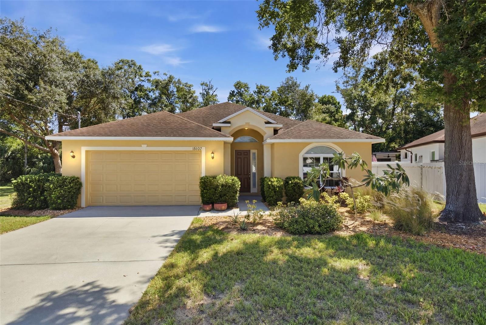 Welcome home to 15107 Monet Drive, a beautifully maintained 3-bedroom, 2-bath residence offering 1,630 square feet of comfortable living space on an oversized pie-shaped lot with no rear neighbors. Nestled in a convenient Tampa location, this home combines privacy, functionality, and outdoor enjoyment while keeping you close to everything the city has to offer. Step inside to discover a bright, inviting floor plan featuring easy-to-maintain flooring throughout with absolutely no carpet, creating a clean, modern feel that's perfect for both everyday living and entertaining. The spacious primary suite serves as a relaxing retreat, complete with a large soaking tub, separate walk-in shower, and plenty of room to unwind after a long day. The home's thoughtful layout also includes a generously sized laundry room, providing additional storage and convenience for busy households. Outside, you'll find one of the property's most impressive features—a large enclosed lanai overlooking a private backyard with no rear neighbors. Whether you're hosting friends, enjoying a quiet morning coffee, or soaking in the jacuzzi under the stars, this outdoor living space offers year-round enjoyment and a true Florida lifestyle. Situated on a large lot with pavered outdoor areas and plenty of room to spread out, this property offers a rare combination of privacy and accessibility. Residents will appreciate being centrally located near shopping, dining, and everyday conveniences, while also enjoying quick access to Tampa International Airport, Downtown Tampa, major highways, and the area's top attractions. If you're searching for a move-in-ready home with indoor comfort, outdoor relaxation, and an unbeatable location, 15107 Monet Drive delivers the perfect blend of all three.