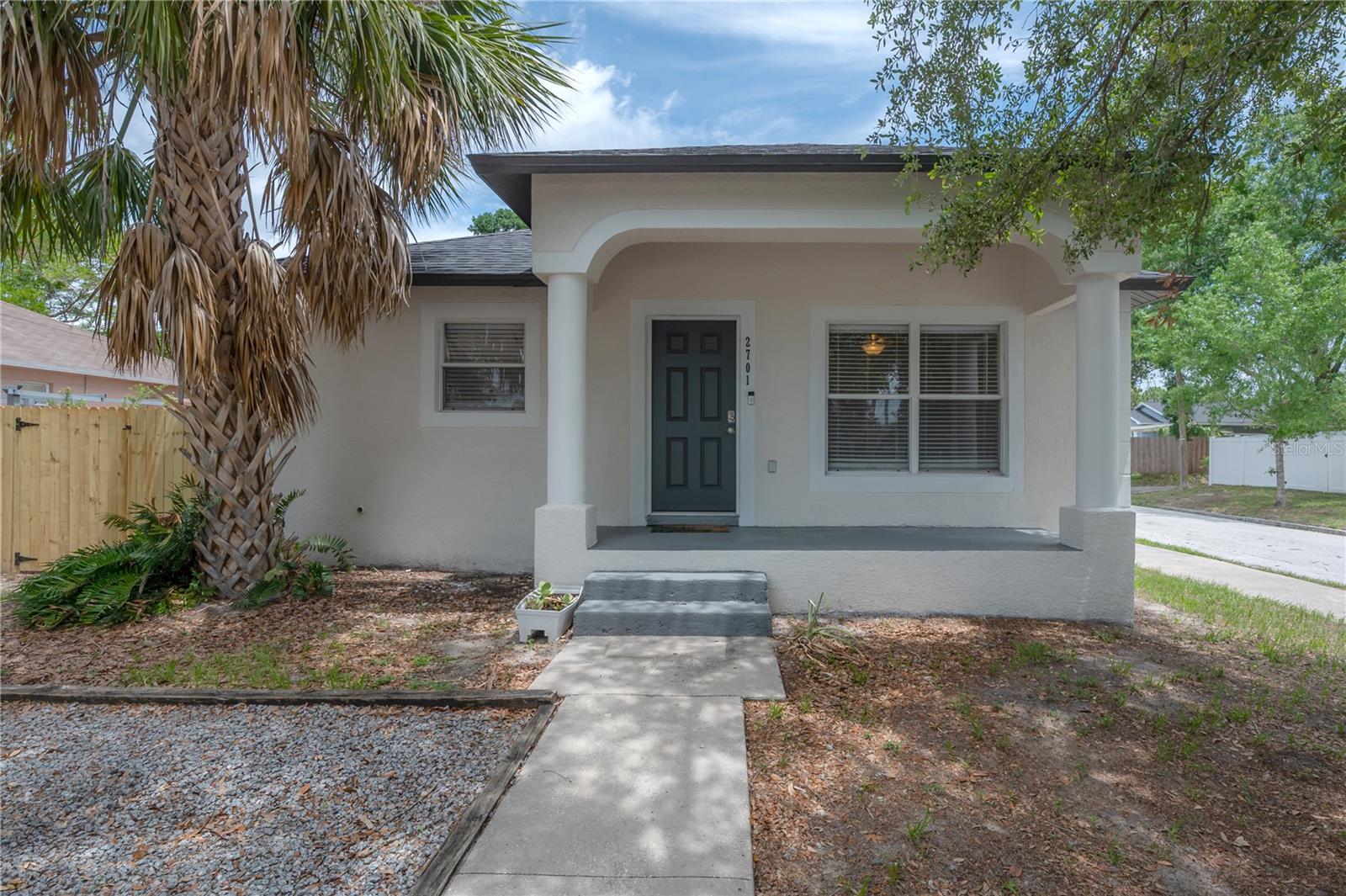 This charming 3-bedroom, 2-bath home offers the perfect combination of character, convenience, and functionality. The roof was replaced in 2023.  The Kitchen was freshly updated, along with the 2 bathrooms. Built in 2005 and situated on a desirable corner lot, with plenty of parking,  the home features a large backyard with plenty of room for a pool, boat, RV, wave runners, or other recreational vehicles.

The inviting front porch welcomes you into a bright, open-concept floor plan with spacious living and dining areas designed for everyday living and entertaining. French doors from the dining area open to a 16' x 12' paver patio, creating a seamless indoor-outdoor living experience. The home has been freshly painted and features laminate flooring throughout, no carpet. Additional updates include a newer HVAC system and included appliances: refrigerator, range, microwave, dishwasher, washer, and dryer.

Enjoy the freedom of NO HOA and NO CDD fees while living just minutes from Tampa's most popular destinations. Conveniently located near Downtown Tampa, Midtown, Hyde Park, South Tampa, Armature Works, the Riverwalk, Raymond James Stadium, Tampa International Airport, major shopping, dining, entertainment, and quick access to I-275 and area bridges.

Whether you're looking for a primary residence, second home, or investment property, this move-in-ready home delivers location, flexibility, and value in one of Tampa's most convenient areas.
