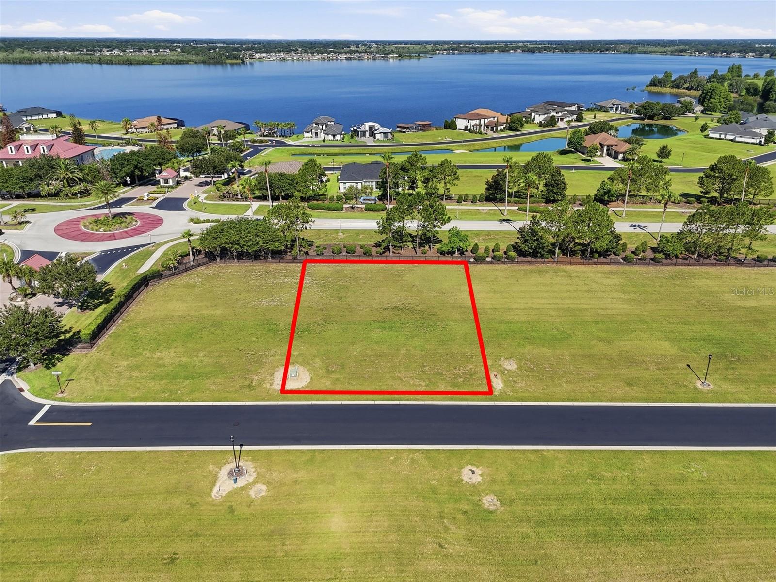 Build your custom home in Water Ridge, one of Central Florida's premier gated lake communities in Lake Alfred, Florida. This homesite presents an opportunity to design and build a custom residence surrounded by the natural beauty of Lake Alfred, Lake Van, and Lake Medora.

Water Ridge offers an impressive collection of resort-style amenities including a clubhouse, fitness center, multiple swimming pools, lap pool, tennis courts, pickleball courts, basketball court, walking trails, boat docks, and community lake access. Enjoy boating, fishing, kayaking, paddleboarding, and an active outdoor lifestyle in a community designed to take advantage of Florida's year-round sunshine.

Ideally situated in Polk County between Orlando and Tampa, this location provides convenient access to Interstate 4, major employment centers, shopping, restaurants, medical facilities, golf courses, and entertainment. Nearby destinations include LEGOLAND Florida Resort, the Winter Haven Chain of Lakes, Downtown Winter Haven, Downtown Lakeland, and Bok Tower Gardens.

Whether you are seeking a custom luxury home site, primary residence location, or seasonal Florida retreat, Water Ridge offers the perfect blend of recreation, convenience, and lake community living. Experience the Florida lifestyle in a gated community known for its amenities, scenic surroundings, and central location.

Buyer and buyer's agent to verify all information deemed important including lot size, dimensions, HOA regulations, building requirements, utility availability, zoning, and school assignments.