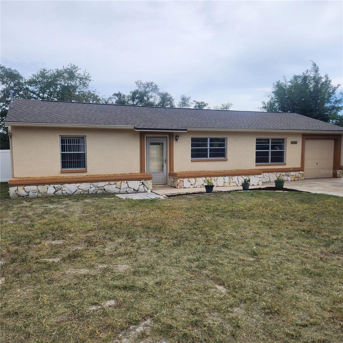 Completely remodeled 2 bedroom 2 bathroom home with a BONUS room and an attached garage! New Roof and new A/C installed in 2026
Kitchen features include granite counter tops, a 7' long breakfast bar and plenty of cabinet space including a built in pantry. Two new bathrooms one with a walk in shower and the other a tub with shower. New flooring and fresh paint throughout the house. This home has a spacious backyard and is built on nearly a quarter acre. It has 2 sheds out back offering extra storage space for tools and equipment. No HOA fees! Located just minutes from the Suncoast Parkway, making commuting to Tampa quick and easy.
