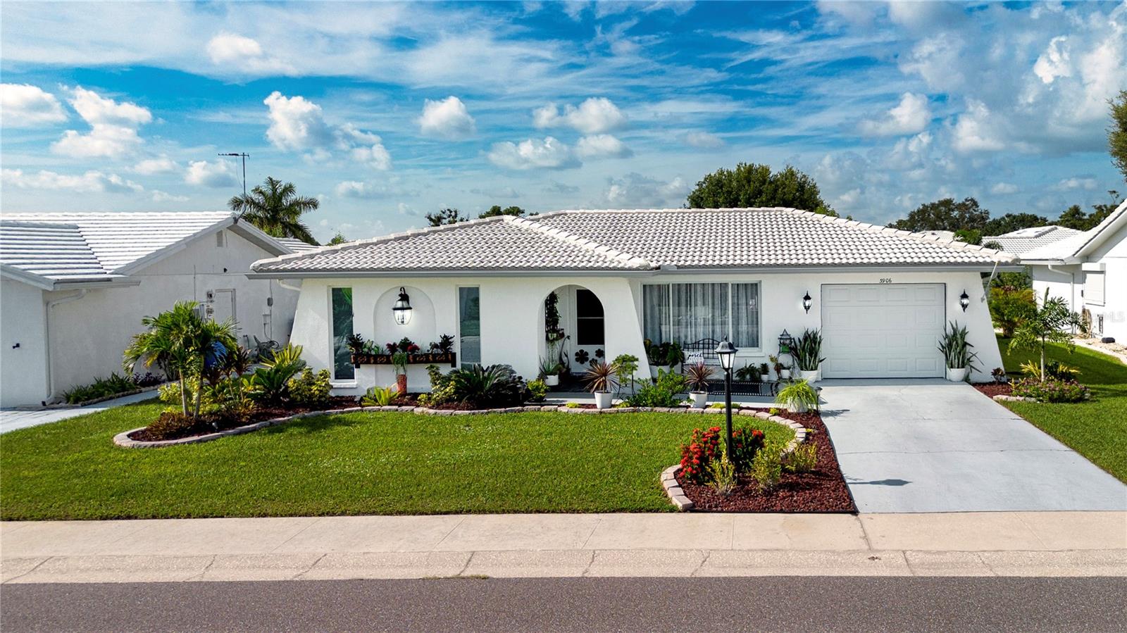 Welcome to River Isles, a tucked-away 55+ golf course community nestled along the scenic Braden River and home to one of the lowest HOA fees-$60 monthly. This beautifully updated 2-bedroom, 1-bath residence showcases thoughtful upgrades and attention to detail throughout. From the moment you enter, you’ll appreciate the stylish Mid-Century Modern aesthetic. The designer kitchen is truly the heart of the home, featuring a custom arched sink opening, hand-selected glass and stone tile with herringbone pattern, and Crowndale luxury quartz countertops. Newer, smudge-resistant four-piece appliance suite, soft-close cabinetry, chic gold fixtures, and ceiling-high cabinets with modern hardware complete this striking space. LVP flooring flows seamlessly, complemented by updated baseboards, freshly painted interiors, textured ceilings, recessed lighting, remote-controlled ceiling fans, and upgraded electrical components—offering both beauty and peace of mind. French doors open to a spacious Florida room, ideal for entertaining guests or enjoying quiet moments of relaxation. The powder room adds a unique touch with a handpicked antique Italian sink and commode. Outdoors, the seller-curated landscaping creates a welcoming setting, while the oversized patio provides space for outdoor dining or gatherings. Every improvement has already been completed—making this home truly move-in ready. River Isles offers an array of amenities including a clubhouse, heated pool, shuffleboard, fitness room, billiards, library, and an active social calendar. Golf enthusiasts will love the River Isles Golf Club, featuring a 9-hole executive course with an optional annual membership offering unlimited play at an affordable rate. Conveniently located near I-75, shopping, dining, entertainment, medical facilities, airports, and public transportation, this community blends peaceful surroundings with an active lifestyle. If you’re seeking quality upgrades, low monthly expenses, and a vibrant 55+ community, River Isles is the perfect place to call home.