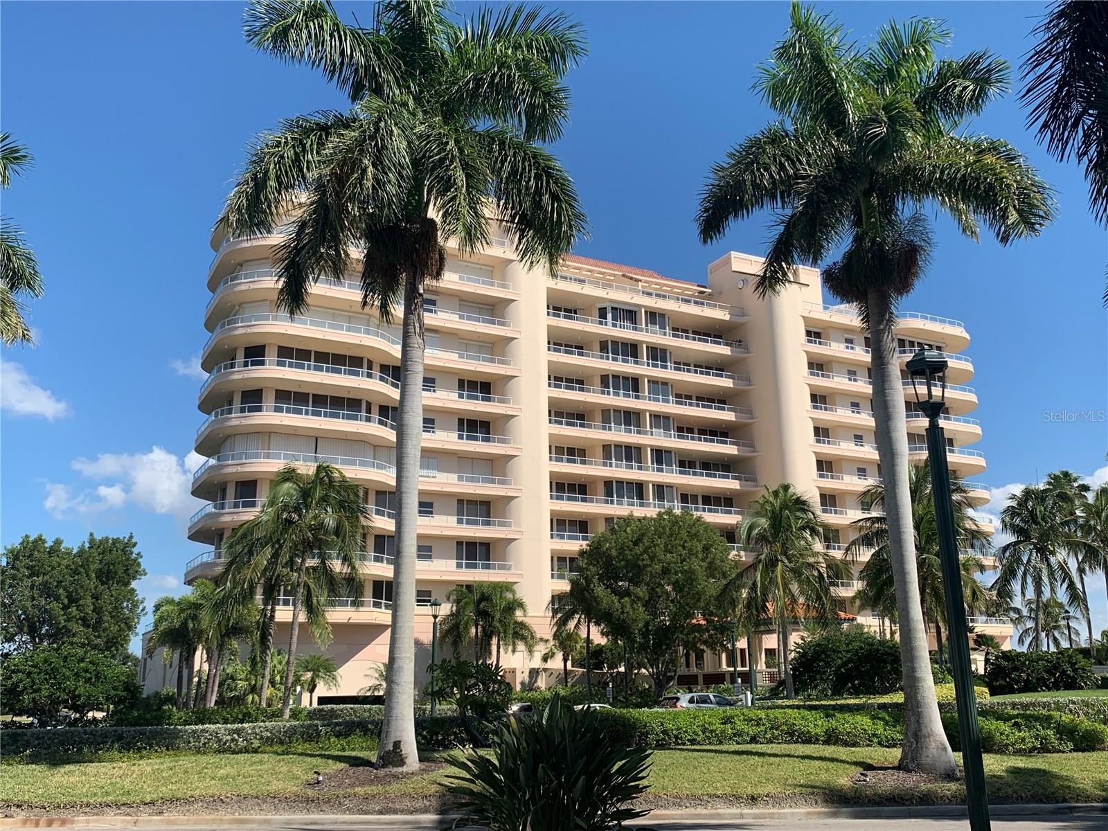 PRICE POINT ADJUSTMENT ON HIGH FLOOR UNIT!  Resort Living At It's Finest with this Grand Bay Condominium offers Privacy in the exclusive Bay Isles community.  Grand Bay is situated directly on Bishops Point offering extensive Sarasota City views. Get swepted away by the dramatic unobstructed views of the city and expansive Sarasota Bay. The expansive floor to ceiling"Walls of Windows" with terraces on both the east and west sides of the building. Perfect sunrises and sunsets are the order the day ! The open floor plan from living room, to dining room, to den (can be easily converted into a 3rd bedroom) and the convenience of the kitchen all flow smoothly for entertaining and easy living. The den, kitchen, and guest bedroom all face west with access to the terrace for spectacular sunsets. The kitchen offers all of the latest modern conveniences with an oversized SubZero refrigerator/freezer, mini Perlick bottle refrigerator, Bosch dishwasher, Wolf triple oven with microwave, warming oven and Empava induction cooktop. This unit is sold fully furnished with high end quality names like Ethan Allen, Hancock & Moore and Italian leather. The master bedroom boasts panoramic views of the city and connects to the east terrace with plenty of space for sunbathing and nature watching. The marble master bath invites you to soak in the garden tub to relax the day away. Grand Bay Building 1 Caymen unit offers Total Privacy on the East and West Balconies with Glass railings for unobstructed viewing privacy!  The en-suite guest bedroom is currently being used as an office and features its own grand views of the Longboat Key’s Harbourside golf course and the Gulf of Mexico beyond. Grand Bay is situated behind the Longboat Key Club gates and offers additional gated security at the building entrance for your peace of mind. Amenities for your enjoyment include two Har-Tru tennis courts, a state-of-the-art fitness center on the second floor of the Newly modernized Grand Bay clubhouse, two large heated pools and private beach access to the Newly modernized PRIVATE Bay Isles Beach Club directly on the Gulf of America. Grand Bay offers Electric Car Charging Stations.  The Travertine stone floors are polished to perfection and is in pristine condition.   This is resort style living, at its finest with the convenience of being located on Longboat key. Just minutes from St. Armand's world renowned shopping, restaurants and the cultural capital of Florida that is downtown Sarasota. Memories that will last a lifetime....All offers submitted via FAR-BAR contract form. Please use showing time button for all showings