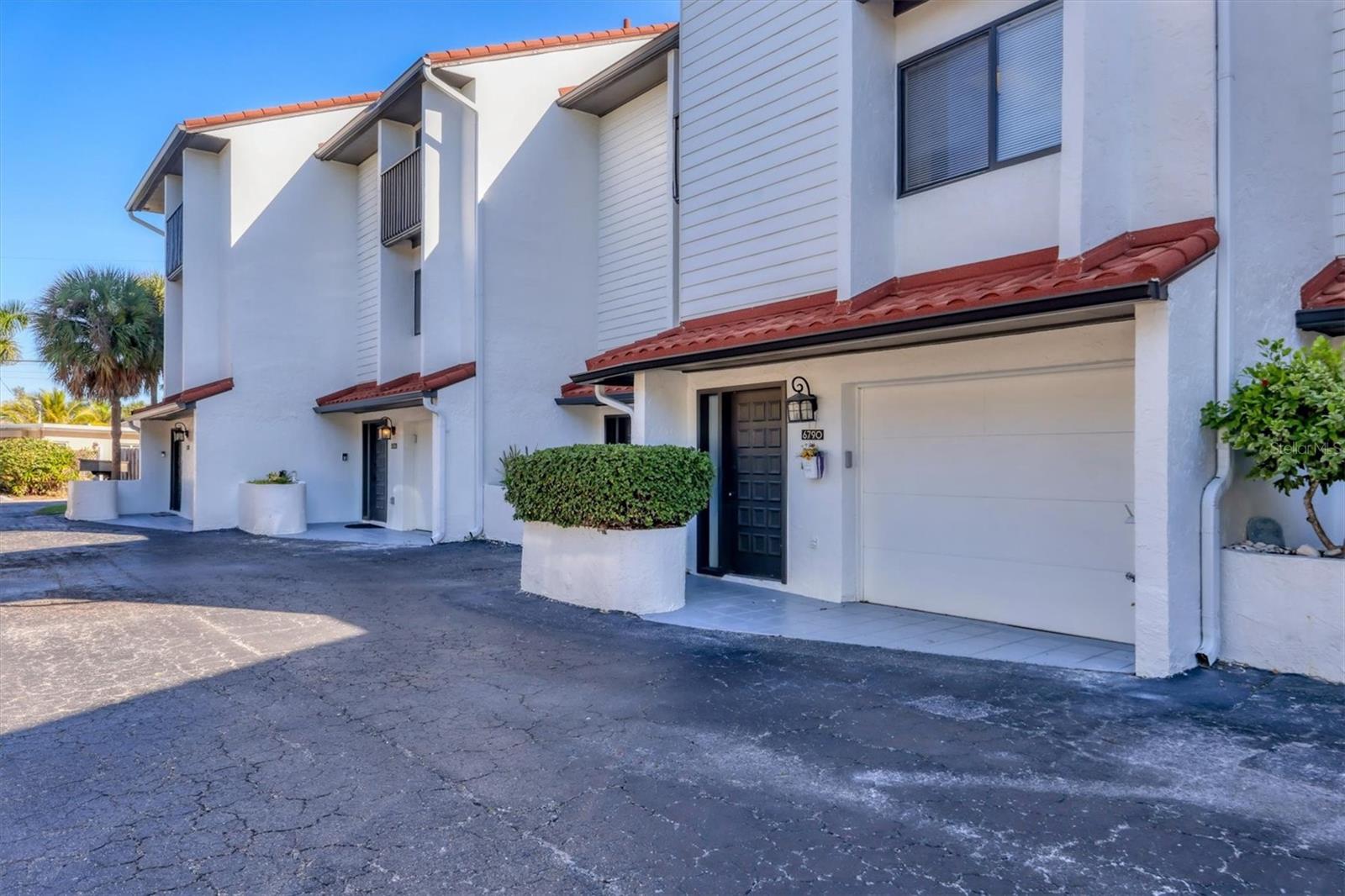 Just steps from Point of Rocks Beach! This 3BR/2.5BA townhouse with a garage at 6790 Sarasea Circle offers the best of coastal living in an exclusive 12-residence community. Enjoy direct access to Siesta Key’s world-famous beaches and village. The 1,446 sq. ft. interior features wood flooring, a cozy fireplace, and a screened lanai overlooking the pool. The bright kitchen includes white cabinetry, generous counter space, and a pass-through breakfast bar. Upstairs, 2 inviting bedrooms each feature private balconies, ample closets, and abundant natural light. Bathrooms are thoughtfully designed for comfort and convenience one on each floor, including en-suite and Jack-and-Jill layouts on the third floor. An oversized one-car garage provides direct access to a versatile lower-level bonus space, 3rd bedroom and laundry room. With up to 12 rentals allowed per year, this property offers excellent income potential in a prime island location close to dining, shopping, and downtown Sarasota.