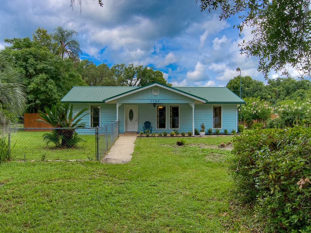 Country living with benefits! .64 Acres property is an 3 bedroom / 2 bath wheelchair accessible home. This home has luxury vinyl flooring and stainless appliances and indoor laundry. The Master bedroom has beautiful crown molding and the master bath has double sinks and a new shower. This home has a hardy board siding, a metal roof, RV/boat parking and a separate office or possible in-law suite.  Presently, the Inlaw suite has a separate entrance, but can easily be opened up to the main house.  Must see lot with citrus trees and more. This home quailifies for 100% USDA financing! Come see!