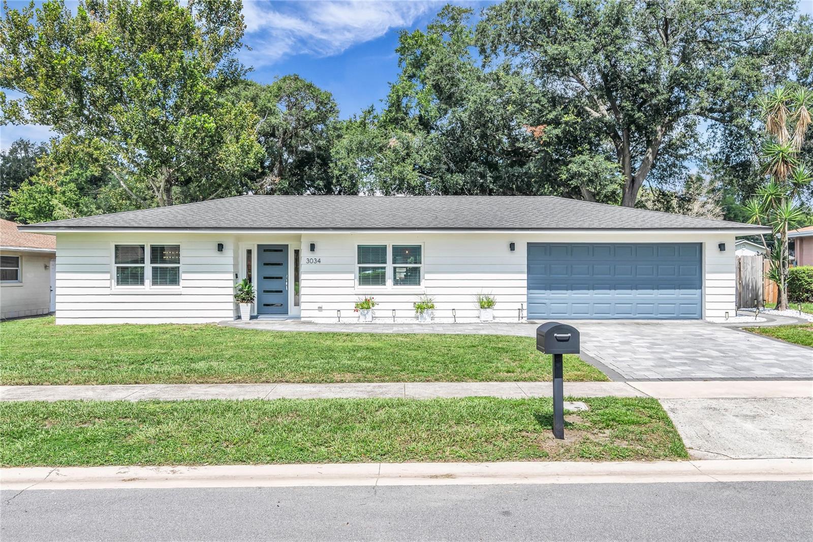 Renovated and move-in ready, this stunning 4-bedroom, 2-bath pool home with an attached 2-car garage offers the perfect blend of modern style, comfort, and an unbeatable Conway/SODO location. Nestled on a quiet street just minutes from the Hourglass District, downtown Orlando, and the Conway Chain of Lakes, this home has been thoughtfully updated inside and out. From the moment you arrive, you'll be charmed by the inviting curb appeal and beautifully landscaped yard. Inside, abundant natural light, luxury vinyl plank flooring throughout, and an open-concept floor plan create a bright, welcoming atmosphere designed for both everyday living and effortless entertaining. The spacious family room is the heart of the home, featuring a sleek electric fireplace and sliding glass doors that open to an expansive screened backporch and the fabulous backyard. The beautifully renovated kitchen overlooks the living and dining spaces and boasts quartz countertops, stainless steel appliances, designer pendant lighting, bar seating, and space for a breakfast nook. The adjacent dining room also makes an ideal home office or flex space. Escape to the private primary suite featuring a beautifully remodeled en-suite bathroom with designer finishes. Three additional bedrooms offer generous closet space, while the renovated guest bathroom includes dual vanities and designer finishes. A large laundry room adds even more functionality with a utility sink, storage closet, and its own split-system A/C. Step outside to your own private backyard retreat. The fully fenced yard is designed for year-round Florida living with a sparkling swimming pool, spacious patio, screened porch, charming dining gazebo, putting green, and maintenance-free turf—creating the perfect setting for entertaining, weekend barbecues, or simply relaxing in your own resort-style oasis. Major updates provide peace of mind, including a new roof (2018), double-pane windows (2018), and HVAC system (2022). The location is exceptional. Enjoy quick access to downtown Orlando, SODO, the Hourglass District, Orlando International Airport, and the Fern Creek public boat ramp providing access to the Conway Chain of Lakes. Outdoor enthusiasts will also appreciate nearby Fort Gatlin Recreation Complex, offering a community pool, tennis courts, basketball courts, playground, athletic fields, and year-round recreational activities. This is a rare opportunity to own a beautifully renovated, move-in-ready home with incredible indoor and outdoor living spaces in a great location.