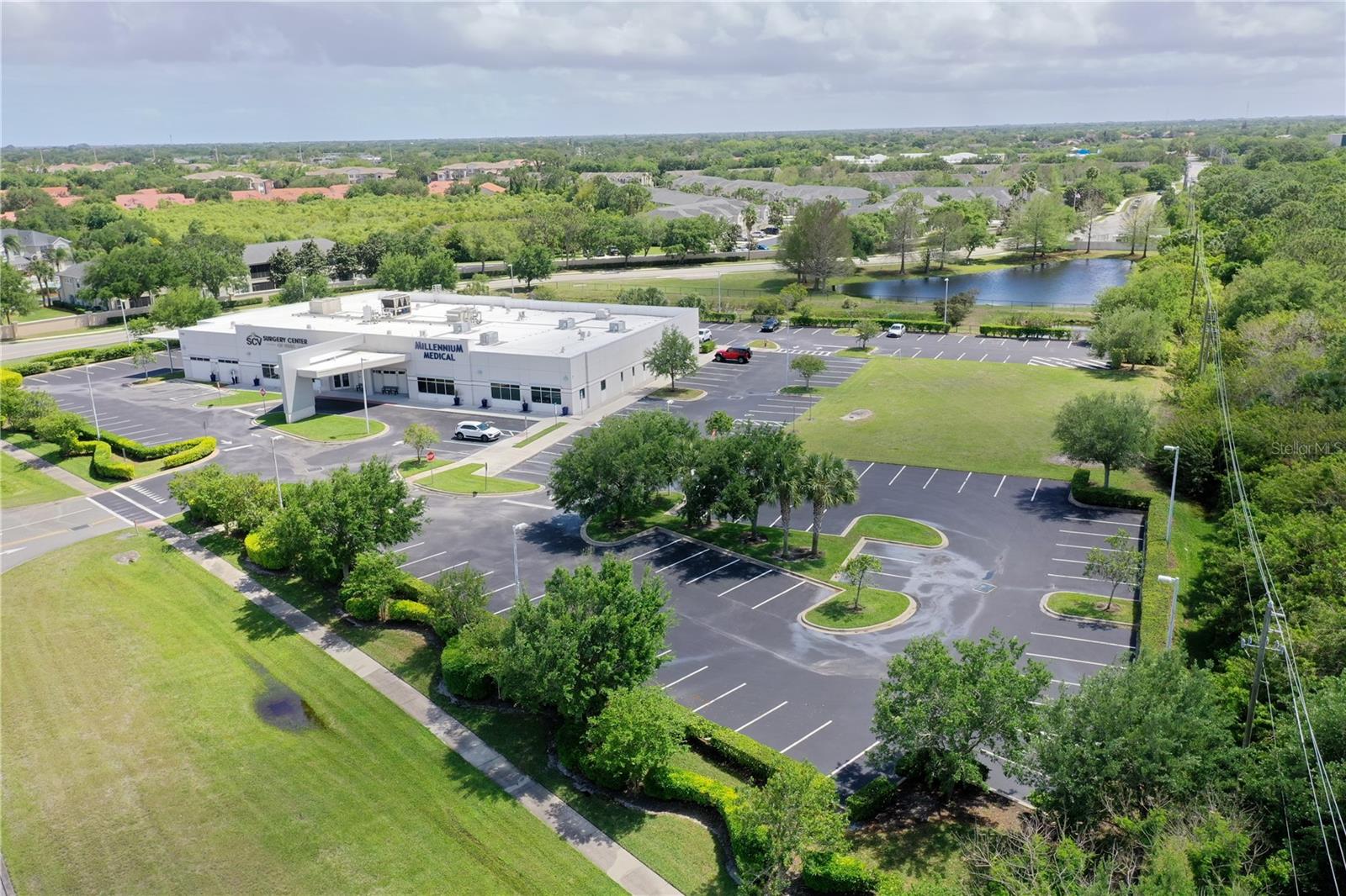 One or more photo(s) has been virtually staged. There are locations you find, and there are locations that find you. 7965 Spyglass Hill Road is the latter.
Positioned inside the Spyglass Medical District of East Viera, this 1.54-acre parcel sits directly adjacent to the DEUK Spine Institute and within walking distance of Viera Medical Center, the Surgery Center of Viera, and Viera Diagnostic Center. The medical ecosystem surrounding this site is not a future projection — it is an operational reality generating thousands of patient visits per week. This parcel sits at its center.
The demand fundamentals are among the strongest in the state. Zip code 32940 grew 23% between 2020 and 2025, adding over 10,000 residents — more than 300 times Brevard County's countywide growth rate. Median household income tops $118,900, more than 50% above the Florida median. The median age is 49.9, and that aging demographic consumes outpatient medical services at two to three times the rate of younger populations. Healthcare is the single largest employment category in the zip code. The dominant consumer profile carries a median net worth of $915,000 and accesses commercial insurance at rates that produce the highest-margin payer mix available to any medical tenant.
The site is zoned BU-1-A, with medical buildings and clinics permitted by right — no variance, no public hearing, no entitlement risk. Water, sewer, gas, and electric are already stubbed to the lot line, eliminating costly infrastructure work before a shovel hits the ground. Interstate 95 is less than 1.5 miles away via Pineda Causeway. The building envelope comfortably accommodates a two-story medical office building of approximately 23,000 square feet.
The vision is clear. A specialty medical office — orthopedics, neurology, physical therapy, dental, or a multi-tenant healthcare hub — built to serve a patient base that already lives here, already drives past this corner, and already trusts the brands that surround it.
Whatever the concept, the foundation is in place. The zoning is confirmed. The utilities are stubbed and ready. The neighbors are exactly who you want them to be. The only thing missing is the building — and that is the opportunity.
