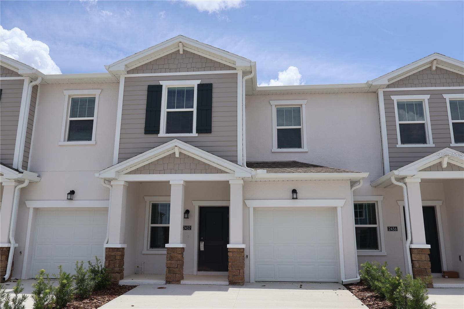 This two-story townhome offers a modern and functional design, featuring a well-appointed kitchen and a spacious Great Room ideal for everyday living and entertaining. Sliding glass doors open to a breezy lanai, perfect for outdoor relaxation. The second floor includes two secondary bedrooms conveniently located near a full bathroom, while the private owner's suite is situated down the hall, offering a luxurious bathroom and a generous walk-in closet. Located in Westview, a master-planned community in Poinciana, residents enjoy access to a community swimming pool, dog park, clubhouse, and sports fields. The nearby Lake Marion Creek Wildlife Management Area offers scenic hiking trails, and the community is close to shopping, dining, and entertainment in Poinciana, with easy access to Highway 17 for commuting to Greater Orlando.