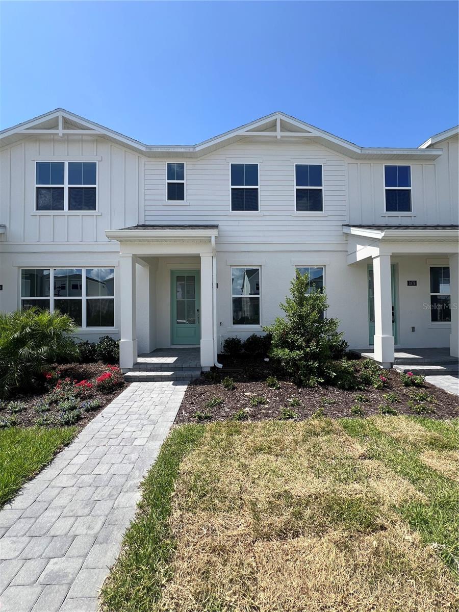 Welcome to the Autumn floor plan, a beautifully designed new construction home offering 4 bedrooms, 2.5 bathrooms, and a 2 car garage with an extended driveway. This thoughtfully designed home features a private courtyard and enhanced landscaping in the front yard maintained by the HOA. The first floor showcases luxury vinyl plank flooring, upgraded white cabinetry, brushed nickel fixtures, a gourmet kitchen with KitchenAid appliances, an upgraded glass pantry door, and an open stair railing with elegant wood spindles. The open concept layout creates the perfect space for everyday living and entertaining. Upstairs, you will find comfortable carpeted bedrooms, a convenient laundry room with Whirlpool appliances included, two secondary bedrooms with a shared bathroom, and a spacious primary suite featuring a tray ceiling, large walk in closet, and an expansive bathroom. Best of all, all appliances are included, making this home truly move in ready. Residents enjoy access to exceptional community amenities, including a large clubhouse with a resort style pool, a clubroom available for private events and parties, two pickleball courts, a tennis court, a fully equipped fitness center, and a dedicated yoga room.