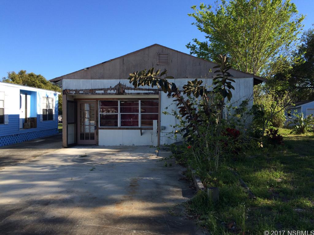 This canal front lot has a seawall and boat house with a rare private boat launch (shared with the neighbor). A concrete pad is already in place for whatever residence you wish to construct. It currently has a building on the property so there is no impact fee. Minutes by boat to Mosquito Lagoon and a short drive to shopping in Edgewater and NSB. THE BUILDING HAS NO VALUE and is being sold for land value only. ;Water: City
