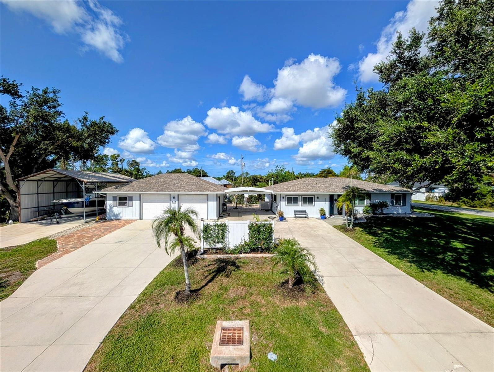 Immaculate move in ready three-bedroom home located in the Gulf Cove Community.*  No HOA fee required.  Flood Zone X - No Flood insurance required.  Outside: Large high corner double lot with tons of privacy. 2-1/2 car detached garage/shop (26x34) (insulated garage doors and walls) possible conversion to guest house or rental - check w/Charlotte Co; large (18x31) covered boat port 12’-15’ high; 10x10 metal storage shed; circular drive; private hot tub on huge paver patio with reinforced privacy fence; 14x14 air-conditioned man cave (new mini split); covered 20x20 parking between home and detached garage. Beautiful trees all recently trimmed – park like setting.
Inside:  Updated three bedroom/two baths; 2281 sf air-conditioned living area; heavy duty 2x6 frame construction with maximum roof to wall fasteners and secondary water barrier roofing system, newer shingle roof (Owens Corning Duration – best shingles on the market). Formal living room; large master ensuite; bedrooms are large; huge combo family/dining – great for entertaining; plantation shutters throughout main home; large air-conditioned laundry/office with tons of storage – great for a business owner or hobby enthusiast; energy efficient newer Stanek windows (8), tankless hot water heater, attic stairs, seamless gutters, fruit trees, storm shutters, park like setting.  
The home is leased through the end of the year. Arrangements can be made for serious buyers.  Truly a move-in ready home.
*Gulf Cove is not an HOA deed restricted community. Gulf Cove property is regulated by Charlotte County’s Code of Laws and Ordinances.
Gulf Cove does have a voluntary property owners association called Property Owners of Gulf Cove, Inc. (POGC). POGC owns two private waterfront recreational properties that encompass a little over 5 acres on the Myakka River. These waterfront amenities are available to Gulf Cove property owners who support POGC through annual membership dues and/or ramp fees. The POGC waterfront park includes a pavilion, picnic tables, benches along the river, and playground area - annual cost $75. The POGC ramp provides direct boating access to Charlotte Harbor and the Gulf of Mexico as well as boat trailer parking - annual cost $75.