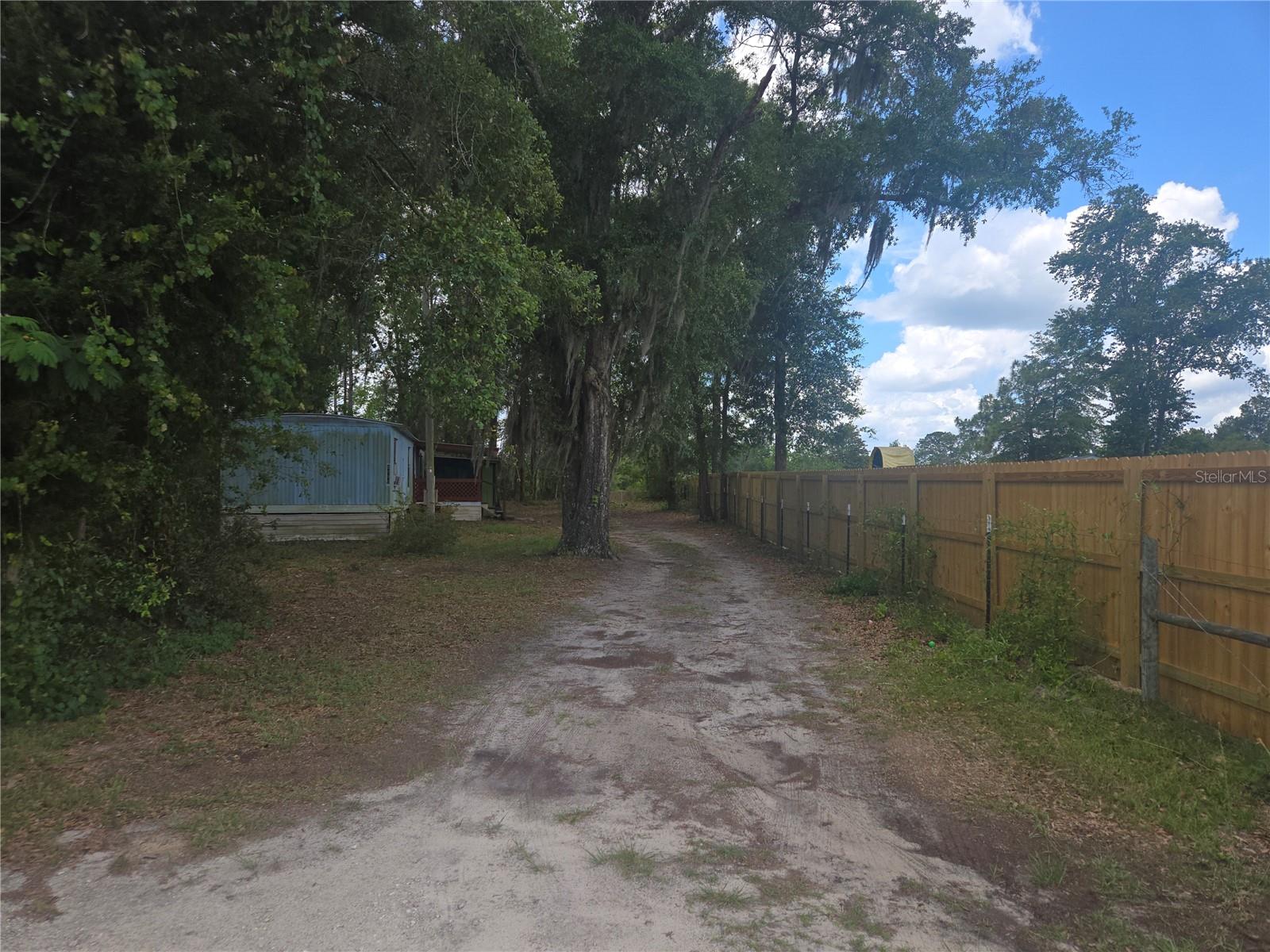 Former rental property. Perfect to live on while building your new home behind, just under 1 acre. Seller is listing agent. Cash only