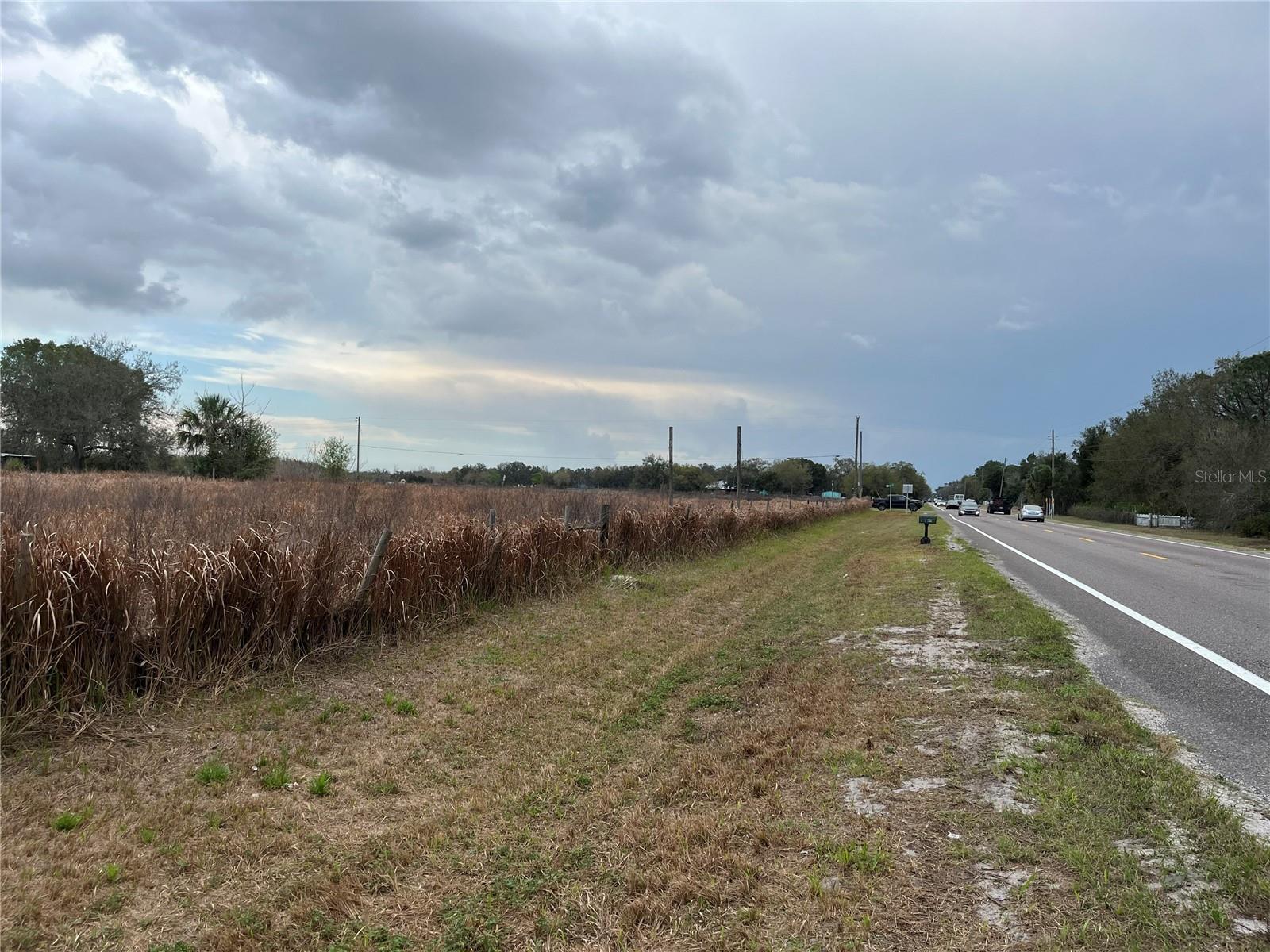 SUPER HUGE VACANT LAND AWAITS A NEW OWNER OR BUILDER INVESTOR!  THIS HUGE 5.78 ACRES HAS FRONTAGE 978 FT X258 FT = 978 FEET ON STATE ROAD 33,  258 FT ON LAW'S ROAD. Perry Lake and North Boat Lake within proximity. This 5.78 acres of land, previously ran Electric on site and a 360 ft. deep well already available in a previously built home on site. Don't let this opportunity slip away. Build your dream home today on this huge homesite. Build your dream home without HOAs. Beautiful countryside and great quiet area .Build your home with easy access to shopping and attractions, 18 miles to Walt Disney World, 27 miles to sea world, 90 miles to Daytona Beach East coast , 83 miles to Clearwater Beach, west coast. Don't miss owning this huge property today.