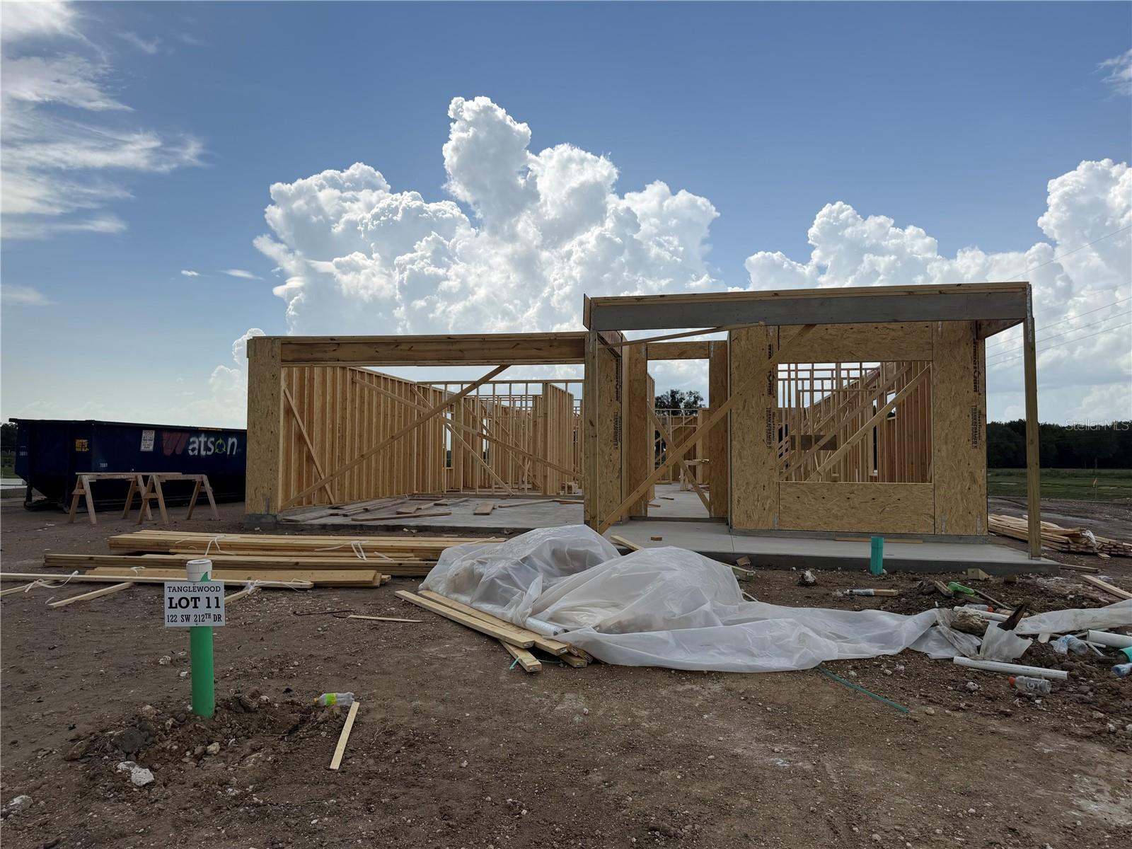 Under Construction. Introducing The Gabby @ Tanglewood!! New floorplan with open concept kitchen, dining and great room area. Affordable luxury and quality construction in SW Gainesville by local developer/builder of over 30 years, Weseman Builders Inc. Check out this brand new 4 bedroom 3 bath home with 1,947 sf. As you walk in the front door, you will notice right away the luxury vinyl plank flooring that will lead you throughout the home including great room, dining area and bedrooms. Spacious open kitchen with wood shaker cabinets, quartz counter tops, decorative tile backsplash, under cabinet lighting, large center island, walk-in pantry, "farmhouse" sink, stainless steel stove, dishwasher and microwave hood. Great room area leads you to the sliding doors that open to the large rear covered lanai which provides access to the large back yard for some outdoor living. The open concept kitchen and great room are designed for entertaining. Spacious primary bedroom with on-suite luxury bath, walk-in closet, double sinks and walk-in shower. Tray ceilings with crown molding in great room, dining area and primary bedroom. 2 car garage with "carriage style" 8 foot tall door for larger vehicles, pull down attic ladder and automatic garage door opener. Premium lot backs up to a common area. Energy saving features like, LED lights, double pane windows, R13 wall insulation, R30 attic insulation, and 15 SEER HVAC. 100% financing (no down payment) options available to qualified buyers. Tanglewood HOA fee is only $95 per month and it included the maintenance of the front lawn, community pool and pavilion. Located between Gainesville and Newberry, right down the street from the newly built Publix marketplace and all the growth that is currently under way. Scheduled completion is September 2026. Photos are of a previously completed, similar floor plan with a similar elevation. Finishes and options may vary. Buyer may choose some selections like flooring, cabinetry and counter tops.