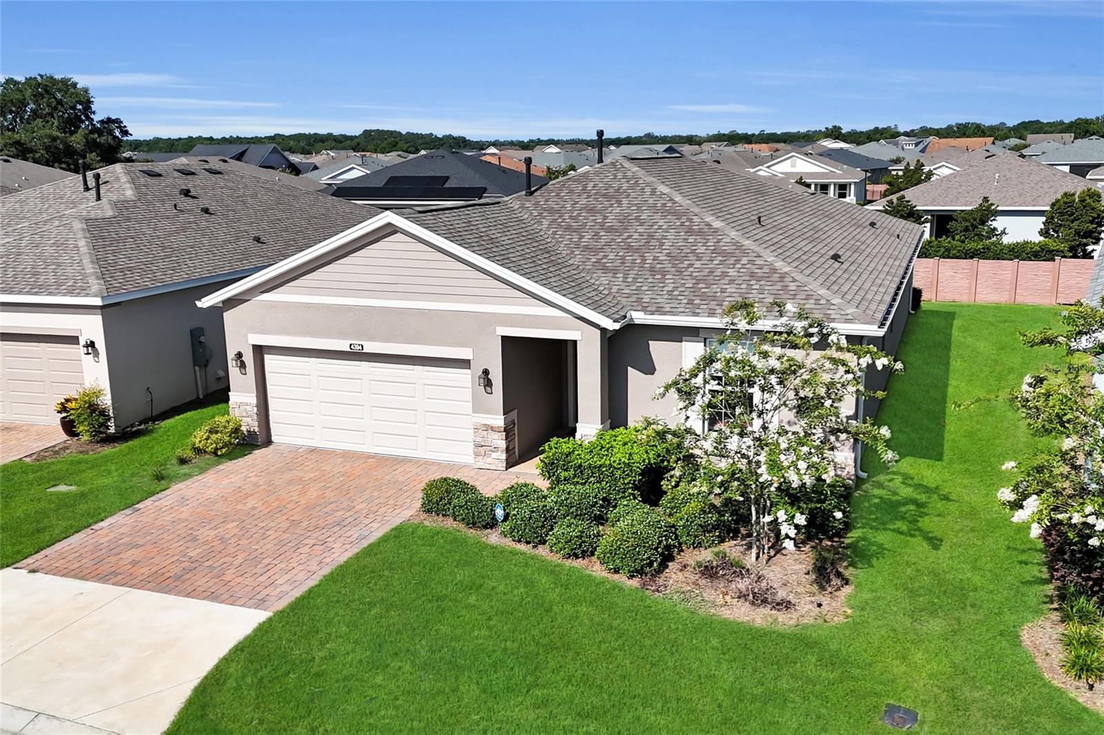 One or more photo(s) has been virtually staged. Experience resort-style living at its finest in this pristine 2023 expanded Connect model home, located in the highly sought-after Ocala Preserve golf community. Situated on an active, social street with planned neighborhood activities, this exceptional home offers the perfect blend of luxury, comfort, and an active Florida lifestyle.
Enjoy the convenience of GOLF INCLUDED, along with HOA-covered lawn maintenance, high-speed internet, and curbside trash service. As a former model home,(Connect Model) this residence showcases premium upgrades, designer finishes, and thoughtful details throughout.
Offering 3 bedrooms, 2.5 bathrooms, plus a versatile den/flex room, this home features an open-concept floor plan designed for both entertaining and everyday living. The gourmet kitchen serves as the heart of the home, featuring a stunning stone island, designer subway tile backsplash, modern cabinetry with under-cabinet lighting, stainless steel appliances, and a gas cooktop.
The spacious primary suite provides a private retreat with a luxurious en-suite bath featuring a walk-in shower, extra-long dual-sink vanity, and a generously sized walk-in closet. A flexible bonus room can serve as a home office, den, hobby room, or formal dining space. The split-bedroom layout offers privacy for guests, with two guest bedrooms, a full bath, and an additional half bath located separately from the primary suite.
Additional highlights include an oversized laundry room with utility sink and drop zone, a speckled epoxy-coated two-car garage, wood-look tile flooring, abundant recessed lighting, cordless window blinds, smart home features, gutters, and a remote-controlled shade for the sliding glass doors.
Step outside to the screened lanai, complete with roll-down shades for added comfort and privacy. The backyard features a privacy buffer wall and offers the potential for easy fencing if desired. ADT security system and ring doorbell installed.
Energy-conscious buyers will appreciate the leased solar panel system, which helps reduce monthly utility costs. The solar lease is approximately $85 a month, with transferable warranties and lease terms.
Residents of Ocala Preserve enjoy exceptional amenities and a vibrant lifestyle, all while being conveniently located near shopping, dining, medical facilities, the World Equestrian Center, Interstate access, and historic Downtown Ocala.
This home is offered partially furnished or fully furnished, providing a move-in-ready opportunity for its next owner. Review the photos, then schedule your private showing and discover why Ocala Preserve is one of Ocala's premier lifestyle communities.