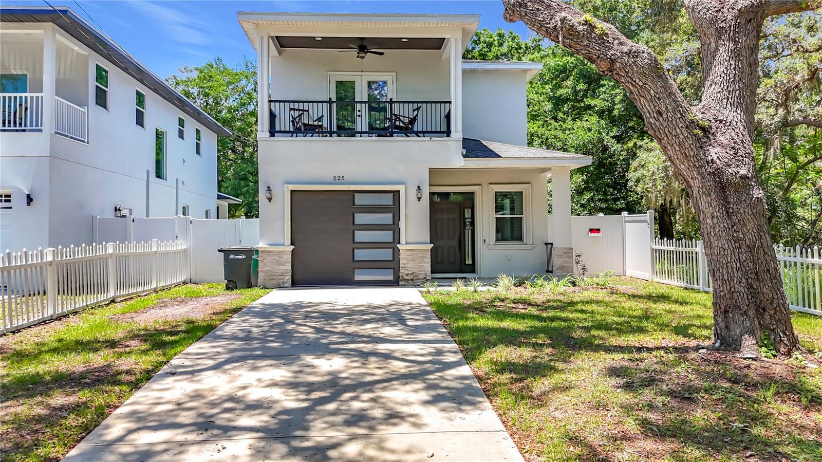 Welcome to luxury living in the heart of charming downtown Safety Harbor! Built in 2023 with exceptional craftsmanship and no expense spared, this stunning custom residence perfectly blends modern elegance with timeless Florida charm. Featuring 3 bedrooms, 2.5 bathrooms, and a spacious two-story design, this professionally constructed home offers the ideal combination of comfort, style, and privacy.
Step inside to discover an open and inviting floor plan highlighted by designer finishes, modern features, stainless steel appliances, and beautiful tile and luxury water-resistant vinyl flooring throughout. The thoughtfully designed split floor plan provides enhanced privacy, while each bathroom showcases custom tile work and upscale finishes. Additional upgrades include double-pane windows for energy efficiency, private garage, vinyl fencing, and professionally designed custom landscaping that enhances the home’s curb appeal. With a covered front porch, a covered back porch, and a bonus outdoor porch on the second story covered with ceiling fan, never miss a Florida sunset, or reading a book for a beautiful sunrise. The oversized fenced in backyard allows for privacy, pets, with plenty of space for outdoor activities, like a summer BBQ, and entertaining family, friends, and guests. Add a pool if you desire! The spacious two-story layout creates flexible living spaces perfect for both entertaining and everyday living. Located in NO FLOOD ZONE, nestled beneath the grand oak trees that make downtown Safety Harbor so desirable, enjoy peaceful shaded walks just minutes from the world-renowned Safety Harbor Resort and Spa, waterfront parks, the bay, boutique shopping, dining, and top-rated schools. This is a rare opportunity to own a nearly new luxury custom home in one of Tampa Bay’s most sought-after communities. Call today for your private showing!