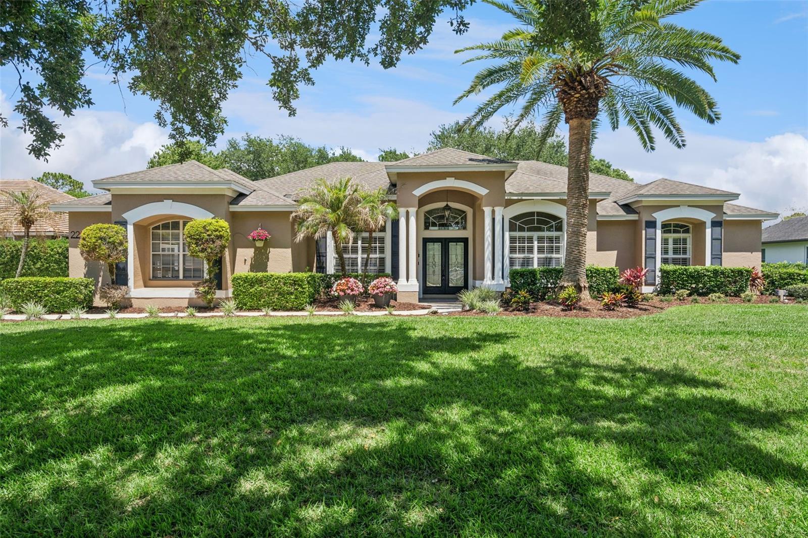 One or more photo(s) has been virtually staged. Spacious and beautifully maintained 5-bedroom, 4-bath pool home situated on a 1/2-acre fenced treed lot in desirable Estates at Windermere. This stunning residence offers a great split floorplan with generous living spaces, high ceilings, and abundant natural light throughout. As you enter the home the dining room is to the left and the living room on the right side could also be an office or den. The spacious family room with built-ins creates the perfect gathering space. The kitchen features granite countertops, stainless steel appliances, ample cabinetry and a breakfast area. The primary suite includes a spa-inspired bath, dual vanities, a soaking tub, and a walk-in shower. There are three spacious secondary bedrooms and two full baths offering flexibility for family and guests. There is a bonus room with a closet and full bath that provides endless possibilities like a mother-in-law suite, guest retreat, home office, media room or the 5th bedroom. Step outside to your private backyard oasis complete with a sparkling screened pool, covered lanai, and beautifully landscaped yard that backs to an expansive greenbelt common area that affords privacy. The owners have made many updates over the years and recently including new sliding hurricane doors, new carpet in all four bedrooms, painted the outside of the house and newer appliances. Conveniently located near top-rated schools, shopping, dining, attractions and major roadways. This exceptional home combines comfort, elegance, and the best of Florida living.