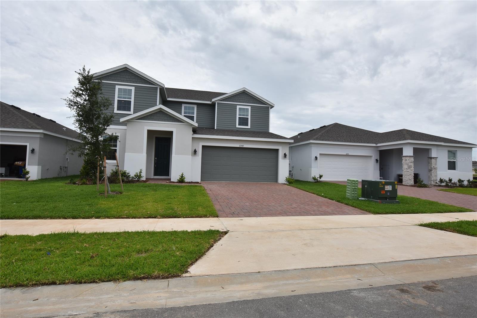 Brand New 2 story home the Lopez Model Located at the stunning community of Groveland Trinity Lakes, beautiful Lake front Community. 5 bedroom 3 full bath & one half bath. Spacious living room that opens up to the kitchen and dining Area. inside laundry. Kitchen with all stainless steel new appliances, stone counter tops and kitchen Island, closet Pantry. One Guest bedroom downstairs with full bath and one half bath in the hallway. Office room with French Door. The Master bedroom is upstairs and Master full bath. The Master split with the remaining bedrooms are upstairs including one hallway full bath and a loft "or upstairs family room". All bedroom floors are carpeted. Wall-to-wall ceramic floors through out kitchen , bathrooms, Landry and office room. 2 car garage with electric remote openers. Covered patio. Outside deliveries storage room with coded door lock.
Trinity Lakes Community has state of the Art Swimming Pool, club, picnic and play grounds. Quiet Country style living. Conveniently located with easy access to C.R 19, Hwy 27 and Florida's Turnpike. Minutes from local shops, restaurants and Farmers Markets. Florida's Turnpike making it a quick 30-minute drive to downtown Orlando and Major tourist attractions.