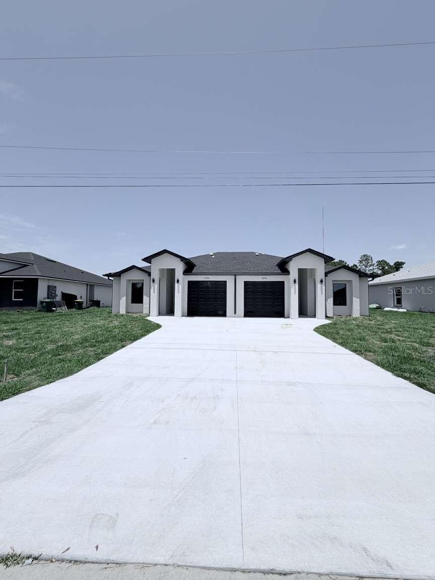Discover an outstanding investment opportunity with this newly completed duplex in the sought-after waterfront community of South Gulf Cove. Built in 2026, each residence offers 1,198 square feet of air-conditioned living space with 3 bedrooms, 2 full bathrooms, an attached one-car garage, and hurricane-impact windows and doors for added peace of mind. Thoughtfully designed for comfort and functionality, each unit features a bright open floor plan that seamlessly connects the kitchen, dining, and living areas. The kitchen includes a convenient breakfast bar, modern cabinetry, and durable finishes, making the space ideal for everyday living and entertaining alike. Whether you are an investor looking for an income-producing property, a homeowner interested in renting one unit, or someone seeking a multi-generational living arrangement, this move-in-ready duplex offers versatility and rental potential. Located in South Gulf Cove, the property provides access to Gulf beaches, shopping, restaurants, medical facilities, schools, public boat ramps, parks, golf courses, canals, marinas, and Charlotte Harbor.