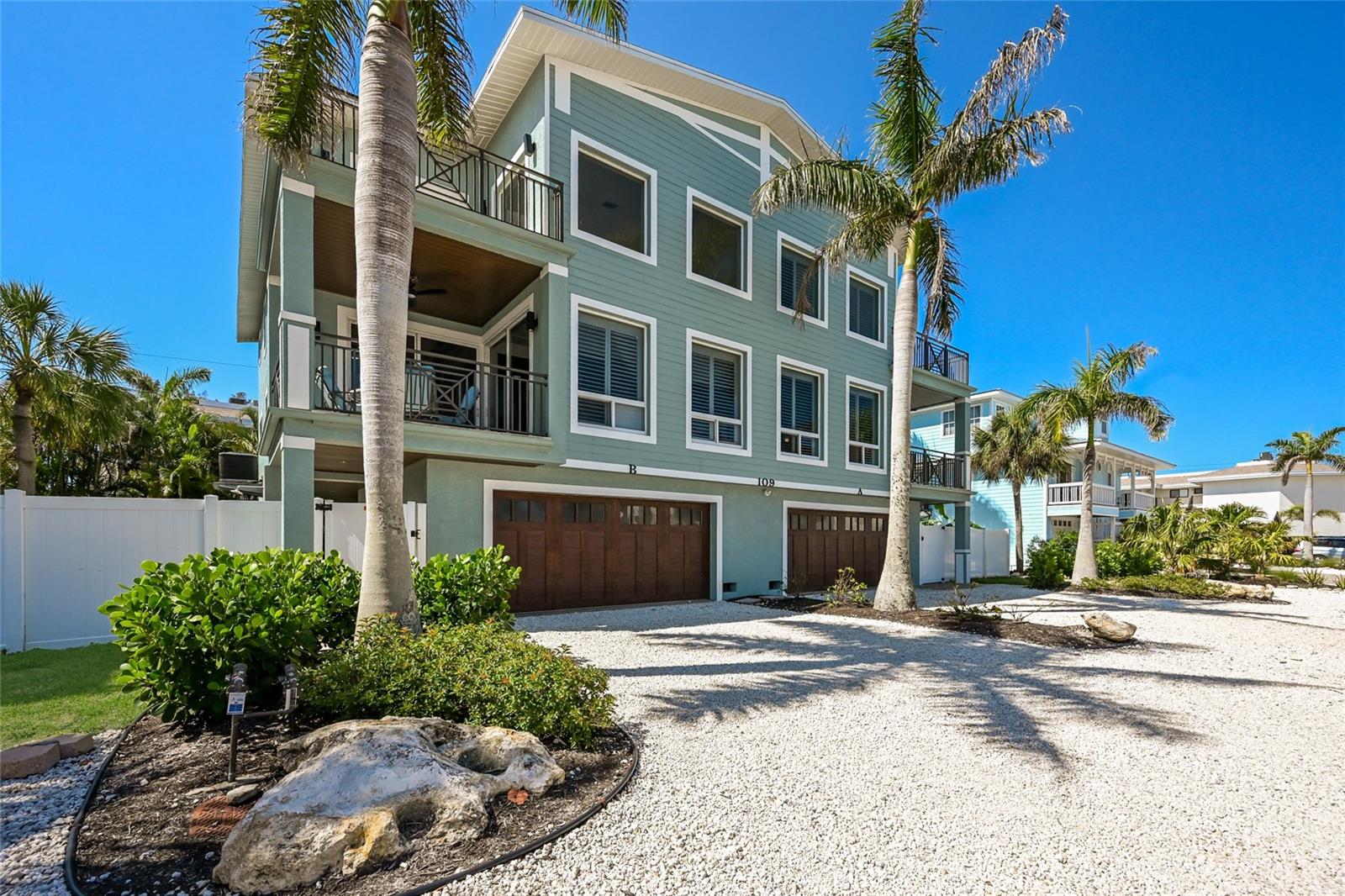 Perfectly positioned in the middle of the Gulf and the Intercostal, you get the best of both worlds!  This 4 bedroom, 3 bathroom pool home is  2,678 sq ft and decorated in fun beachy decor. Offering incredible views in every direction because it’s situated in the best location on the entire island! The island is only 150 yards wide where this 3-story condo is located. The Gulf is merely 75 yards to the west, and Florida’s Intracoastal Waterway is 75 yards to the east. Relax on the 3rd-floor, ceramic-tiled balcony with screened-in lanai, and gaze out across the serene aquamarine Gulf waters, the Intracoastal Waterway, and Florida’s Sunshine Bridge over Tampa Bay and the Bradenton Beach Marina.  The open-concept design of the kitchen/living/dining area makes for easy entertaining. The kitchen island boasts a granite-top bar with stool seating for two, below stylish pendant lamps.  The kitchen flows into a dining area with hardwood floors and a beautiful tropical ceiling fan with natural palm blades, which circulates fresh air throughout the main living space. Enjoy the covered lanai, just off the kitchen/living area to dine or relax.  The Primary bedroom (third floor) has  gorgeous hardwood floors and a walk-in closet.  Enjoy your own private balcony/covered lanai with a sitting area and dazzling views of the turquoise Gulf. Just the spot to sip your morning coffee.   The Primary ensuite bathroom has a large double-sink granite vanity, huge well-lit mirror, marble floors, oversize jacuzzi soaking tub, and separate walk-in glass door showers.  Heated pool, outdoor kitchen and large one car garage, the list goes on.  Enjoy breathtaking sunrises and sunsets from multiple decks overlooking both the bay and the Gulf. Leave your car at home and walk to the beach, restaurants, shopping, the pier, and Bridge Street!  Come explore everything this stunning home has to offer!