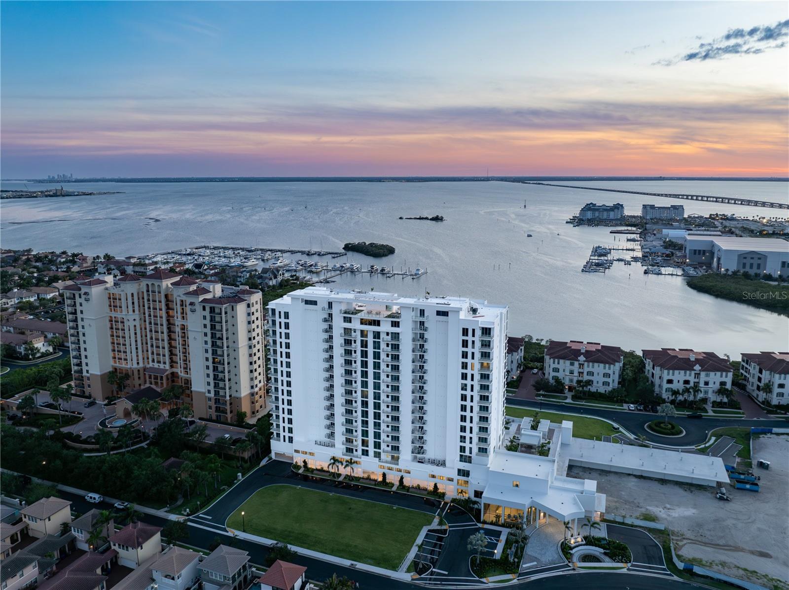 MOVE-IN READY! Introducing AQUA at Westshore Yacht Club — the newest residential tower within South Tampa's premier gated waterfront community. Residence #1002 is a two bedroom, 2.5 bath, plus a den with 2,319 SF.
Standing 17 floors with only 77 residences, AQUA offers a secure-fob private elevator opening into your own entry foyer. Interiors feature Italkraft premium cabinetry, quartz waterfall countertops, large-format porcelain tile, and Sub-Zero/Wolf appliances with an induction cooktop. Floor-to-ceiling windows fill the open living and dining space with light. The west-facing terrace off of the living space offers sunsets over the Bay. The Owner's Suite includes two walk-in closets and a spa-inspired bath with a walk-in shower, soaking tub, and dual vanities.
Building amenities, designed by internationally-recognized Adriana Hoyos, include a rooftop sky pool with Bay views, a 3rd-floor pool and spa, an elegant club room with billiards and private dining, a golf simulator, theater, fitness center with pilates/spin studio, guest suites, and a 24/7 staffed lobby with valet.
Westshore Yacht Club residents enjoy exclusive access to the Bay Club and Marina, 175 boat slips, resort-style pools, Tiki Bar, fine dining, a day spa, and more — just 30 minutes to the beaches and 15 minutes to Downtown Tampa and St. Petersburg.