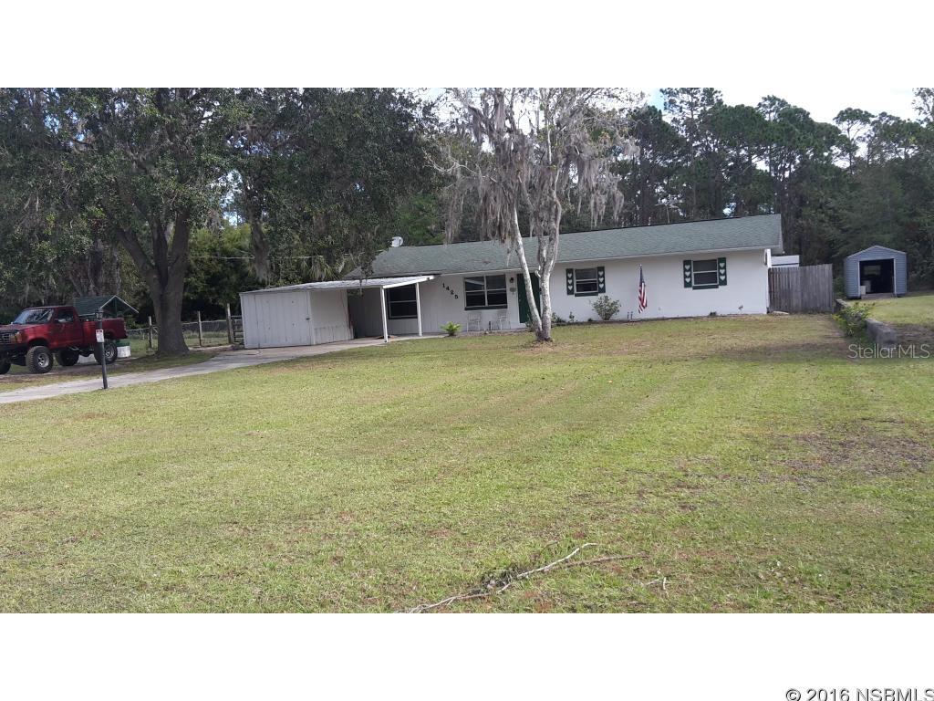 Under contract taking backups. Unique 4 bedroom 2 bath block home on one acre (+or-) near the schools/college on 10th street. Minutes to shopping center and 8 minutes to the ocean.New granite counters and granite topped island. Newly remodeled bathrooms. Huge screened porch and large laundry room. Sale includes hot tub. There are three sheds/work shops, one with AC. Part of this property is on a pond with a dock. Wising well on front lawn. Owner says that the neighbors are wonderful. Property is T-shaped. There is a well with a water softener and a septic tank. No water or sewer bill. Extra large 4th bedroom could be made into an in-law suite. It has its own entrance