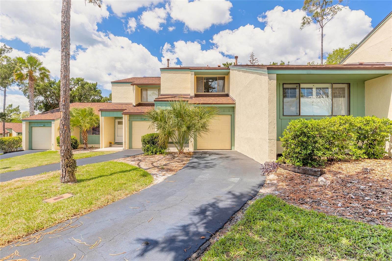 This 2-bedroom, 2.5-bath townhouse-style condominium is in the Sugar Mill Golf Community of Pine Valley.  It features a first-floor kitchen and dining/living area with sliders opening to a back patio which is ideal for outdoor relaxation.  There is also a first-floor laundry room with a half bath for everyday convenience. Upstairs, the primary en-suite includes its own private balcony the overlooks the community courtyard, and the second bedroom offers its own dedicated bathroom providing privacy for both bedrooms. The golf cart-size garage provides storage for a golf cart and the local cart paths make easy access to the community's private golf course (membership is an additional fee).  The garage can double as generous storage space, office, studio or exercise space, for anyone without a golf cart who prefers to use it another way.  Community amenities include private mailboxes, a community pool, and tennis courts and outside the community it is a 15-minute drive to the famous Canal Street, Flagler Avenue and the beach. Come see if this opportunity to own in New Smyrna Beach if right for you and start enjoying the Florida lifestyle soon.  Buyer to pay doc stamps. There are no warranties expressed or implied.  All measurements are approximate.  Sq. footage received from the tax rolls.  All information recorded in the MLS is intended to be accurate but can not be guaranteed.  Buyer should check zoning for rental restriction.