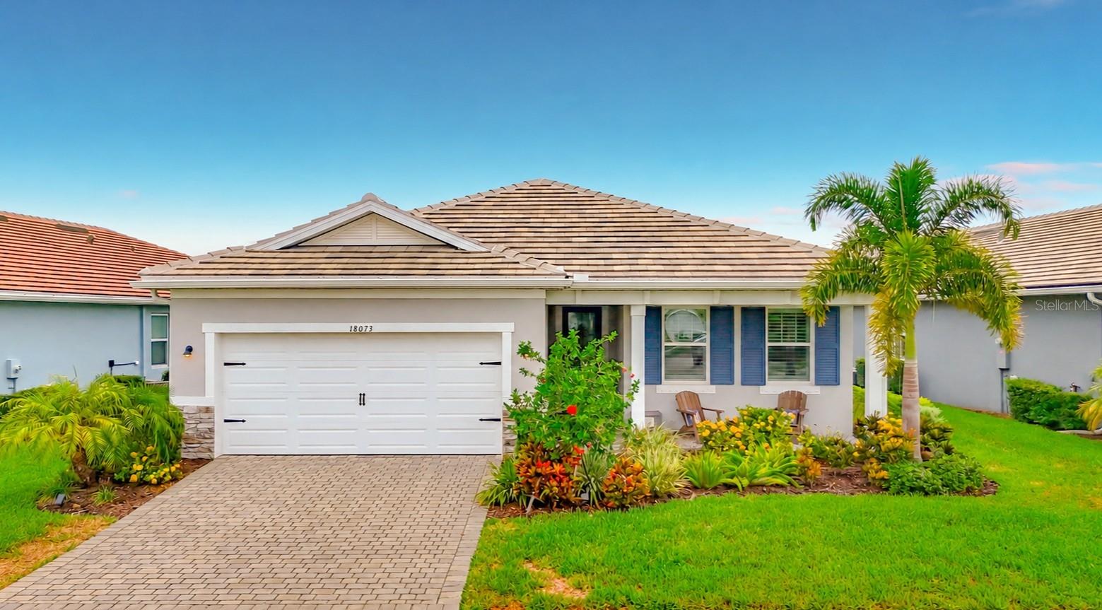 Modern design, thoughtful upgrades, and an unbeatable Wellen Park lifestyle come together in this exceptional home! Built just 3 years ago, this impeccably maintained "Gateway" floor plan by Mattamy Homes features 4-bedrooms, 2.5-baths and 2,200+ sq. ft. of light-filled living space with a desirable split-bedroom plan that provides privacy and comfort for both family and guests. From the moment you step inside, you'll appreciate the soaring volume ceilings, 8-foot doors, expansive windows that fill the home with natural light, and elegant staggered rectangular tile flooring throughout all main living areas. Every detail has been thoughtfully curated, creating a warm yet elegant atmosphere. At the heart of the home is the impressive Executive Kitchen, designed for everyday living and entertaining. It features quartz countertops, wall oven, stainless steel vent hood, tile backsplash, upgraded refrigerator, spacious walk-in pantry, and an oversized center island wrapped in charming shiplap that serves as both a beautiful focal point and gathering place. The owners suite creates a peaceful sanctuary and includes a spa-inspired ensuite bath. Curated with designer finishes, this luxurious retreat features an expansive walk-in shower with a frameless glass enclosure, complete with dual shower heads and independent shower controls for the ultimate personalized experience. A striking decorative tile feature wall creates a dramatic focal point, while pendant lighting and a dual-sink quartz vanity topped with two LED-backlit mirrors add both style and function. Every detail evokes the feeling of a boutique luxury spa, creating a serene space you'll look forward to retreating to each day. Plantation shutters throughout the home add timeless elegance, while a powered retractable shade over the living room sliding glass doors offers convenience and comfort at the touch of a button. Additional features include hurricane shutters for added storm protection and the peace of mind of being located in desirable Flood Zone X. The upgrades continue into the farmhouse-inspired laundry room, complete with added cabinetry and open shelving for both style and functionality. Step outside to your screened lanai overlooking a protected preserve, providing exceptional privacy and tranquil views. With ample space to add the pool of your dreams, the possibilities are endless! Until then, you're less than a 5-minute stroll from Sunstone's spectacular amenities center. Living in Sunstone at Wellen Park means enjoying the epitome of The Florida Lifestyle with a remarkably reasonable HOA fee that includes lawn maintenance, basic cable and internet, resort-style amenities, a community pool, a fitness center, pickleball courts, neighborhood events, and a beautifully maintained common areas -allowing you to spend more time enjoying everything this vibrant community has available! Even better, you're just a short golf cart or bike ride from the heart of Downtown Wellen Park, where you'll enjoy dining, boutique shopping, live entertainment, the weekly farmers market, community festivals, and scenic walking trails. Wellen Park High School, everyday conveniences, restaurants, Costco, medical facilities, and both Venice and Englewood Gulf beaches are just minutes away. Offering the perfect blend of style, comfort, convenience, and location, this move-in-ready home presents an exceptional opportunity to enjoy one of Southwest Florida's most sought-after master-planned communities.