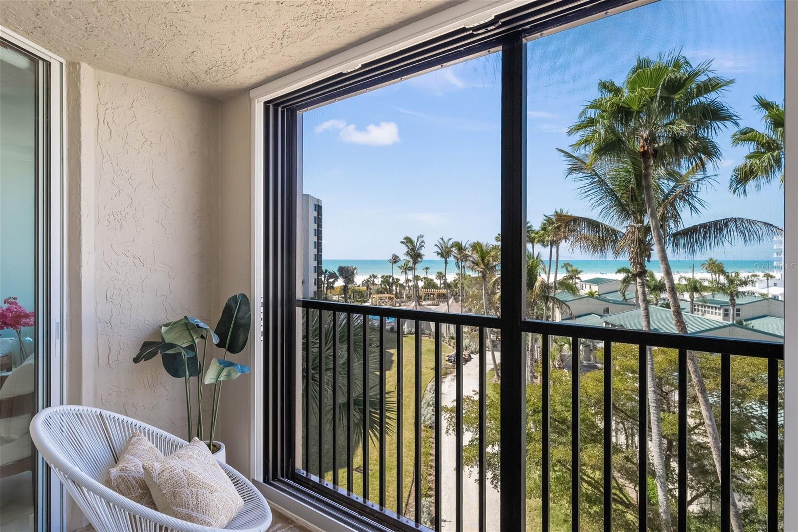 You will be WOWED! by this Furnished 2400+ Sq Ft of Elegant BEACHSIDE LIVING with (3) Generously Sized Bedrooms & (3.5) Baths with STUNNING FINISHES THROUGHOUT!.....RARELY AVAILABLE Corner Unit in this Special Boutique Community---a Resort-Style PET FRIENDLY "low density" plush 7 acre residential complex with over 200 feet of Powdery Quartz sand frontage along with "Old Florida" Clubhouse; Courts; Beachside Pool & Cabanas and an Onsite Manager....Upon Entrance you will be Greeted with a Grand Hallway that leads to a BRIGHT & SPACIOUS Floor Plan, reminiscent of a Single Story Home...Each Bedroom is Privately Located, each with it's own Full Baths....ENTERTAINING is "Extra Special" with Expansive Living Areas and Ideally Centrally Located Wet Bar....WELL-APPOINTED INTERIORS, including: Porcelain Tile throughout; Quartz Countertops; Hurricane Impact Windows/Sliders; "Hotel Style" Primary Suite with Seating Enclave & Sumptuous Ensuite Bath; Abundant Storage & Closet Space; In-Unit Laundry and Importantly...ease of Indoor/Outdoor Living with Multiple Sliders leading to  "Wrap-Around" Balcony/Lanai--Perfect for Morning Coffees or Indulging your Favorite Cocktails while Watching Majestic Sunsets over the Gulf....*****Deeded Beach Access, convenient for long strolls collecting Seashells or just "Toes in the Sand" relaxing at Top Rated Siesta Key Beach.   Dining/Shopping and Nightlife of the main village are just minutes away...GARAGE PARKING...---Ideal as Second Home/Vacation, Investment or Year-Round Residence.  Island Living @ It's Finest!