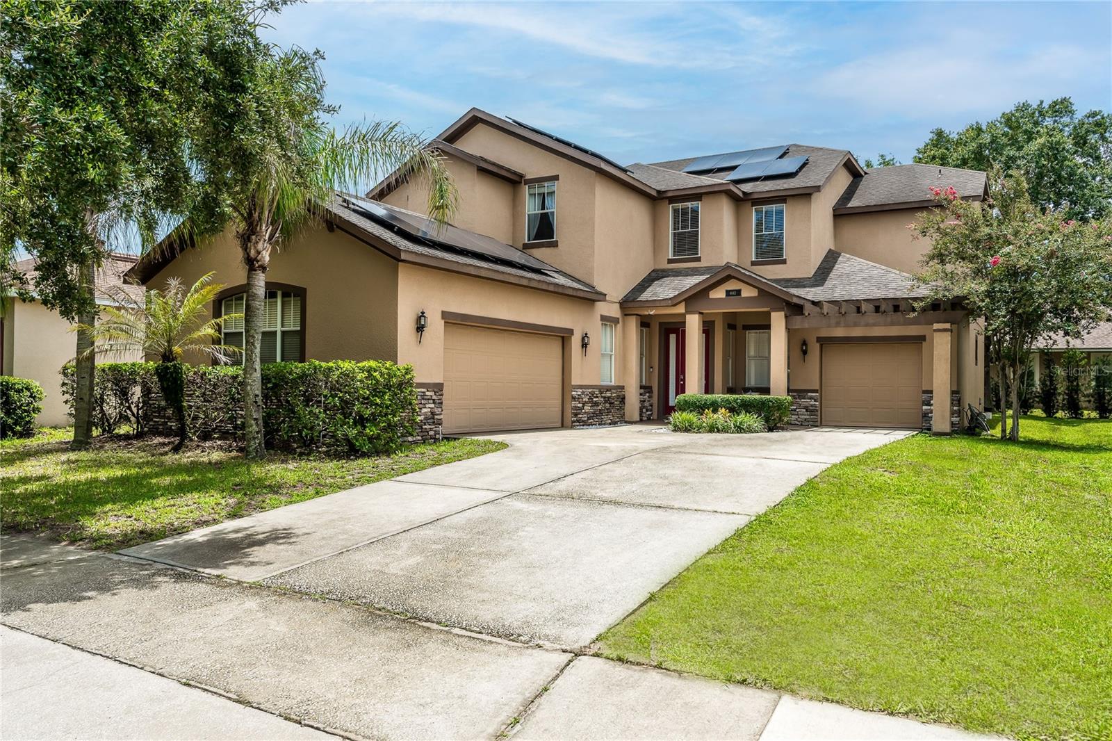 Discover refined living in one of Windermere's most sought-after communities. This exceptional 5-bedroom, 5-bath residence in Summerport perfectly blends timeless elegance, everyday comfort, and an unmatched location. Offering an ideal floor plan for both everyday living and entertaining, this beautifully maintained home features a dedicated office, formal dining room, spacious living room, family room, and thoughtfully designed living spaces throughout.

The entire first floor showcases upgraded luxury vinyl flooring, while the gourmet kitchen is appointed with beautiful granite countertops, stainless steel appliances, abundant cabinetry, and a breakfast bar with seating, perfect for casual dining and gathering with family and friends.

Situated on an oversized homesite, the backyard has been thoughtfully upgraded to create the perfect outdoor retreat. Enjoy a spacious covered lanai, an extended paver patio, and a fire pit, offering the ideal setting for entertaining or relaxing under the shade of the mature Trees.

Upstairs, you'll find all 5 generously sized bedrooms, each complemented by access to a full bathroom, providing exceptional comfort and privacy for family members and guests alike. The first floor features a spacious private office that can easily be converted into a media room or 6th bedroom, complemented by a full bathroom for added flexibility. A spacious 3-car garage offers abundant room for vehicles, storage, and recreational equipment.

Designed with efficiency in mind, the home is equipped with solar panels producing approximately 22–23 MWh annually, delivering substantial energy savings while reducing utility costs.

Summerport is one of Windermere's most desirable communities, offering residents an exceptional lifestyle with resort-style amenities, including a community pool, fitness center, tennis courts, sand volleyball courts, playgrounds, scenic walking trails, and beautiful lakes. Families will appreciate being zoned for highly rated schools, including the sought-after Windermere High School. Ideally located just minutes from Walt Disney World, Winter Garden Village, Publix, premier shopping, dining, and major highways, this home presents a rare opportunity to enjoy luxury living in one of Central Florida's most prestigious communities.