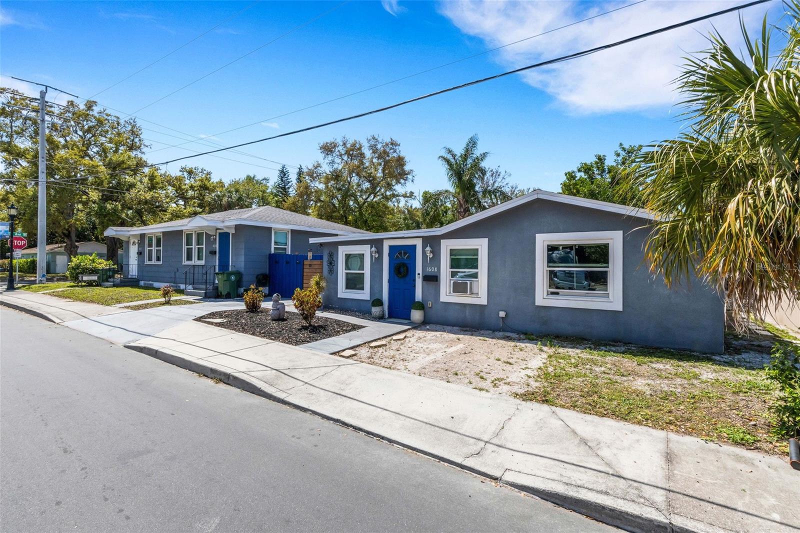 Located in the heart of the Village of the Arts, this unique income-producing property offers a rare blend of character, flexibility, and proximity to downtown Bradenton and LECOM Park. The property consists of a duplex with two one-bedroom, one-bath units, each with access to a shared outdoor laundry area, along with a separate single-family home featuring two bedrooms, one bath, and its own private indoor laundry.
A spacious yard, enhanced by newer fencing, creates separation between the duplex and the single-family home, offering added privacy and usability for both living and rental scenarios. Off-street parking adds to the overall convenience for residents and guests. Recent improvements include newer roofs on both structures, impact windows, Hardie board soffits, and updated porch roofs. All units feature easy-care flooring, and the two-bedroom home includes a mini-split A/C system along with most appliances recently updated. Each unit is on its own electrical meter. Well positioned in one of Bradenton’s most recognizable districts, this property has consistently attracted tenants due to its location and overall condition, making it a strong addition to an investment portfolio.