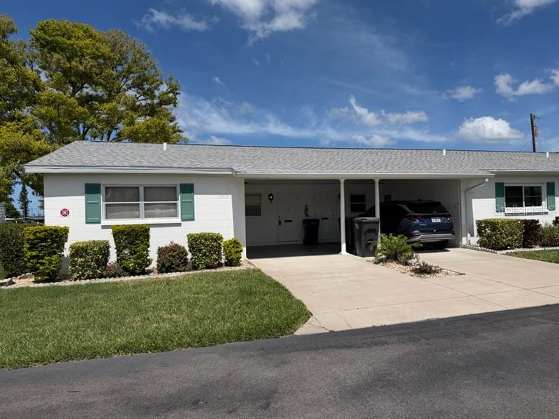 Opportunity Knocks!! Where can you find a nice 2-bedroom, 1 bath villa with an attached carport, updated kitchen and bath in a convenient location for this super price? Tile floor throughout, granite countertops in kitchen, inside full-size, stackable washer & dryer, 2 walk-in closets, and ceiling fans in almost every room. Large community pool has recently been refinished. The water sparkles and invites you to jump in. Enjoy a friendly game of shuffleboard or participate in some of the Clubhouse activities. This is a very active senior community. Located just west of US41 (14th St W) near the Sarasota Bradenton International Airport. Drive south to Downtown Sarasota with all its restaurants, arts boutiques and theatres.  IMG and SCF are close by. Travel north to various shops or take a short drive to the fishing village of Cortez.