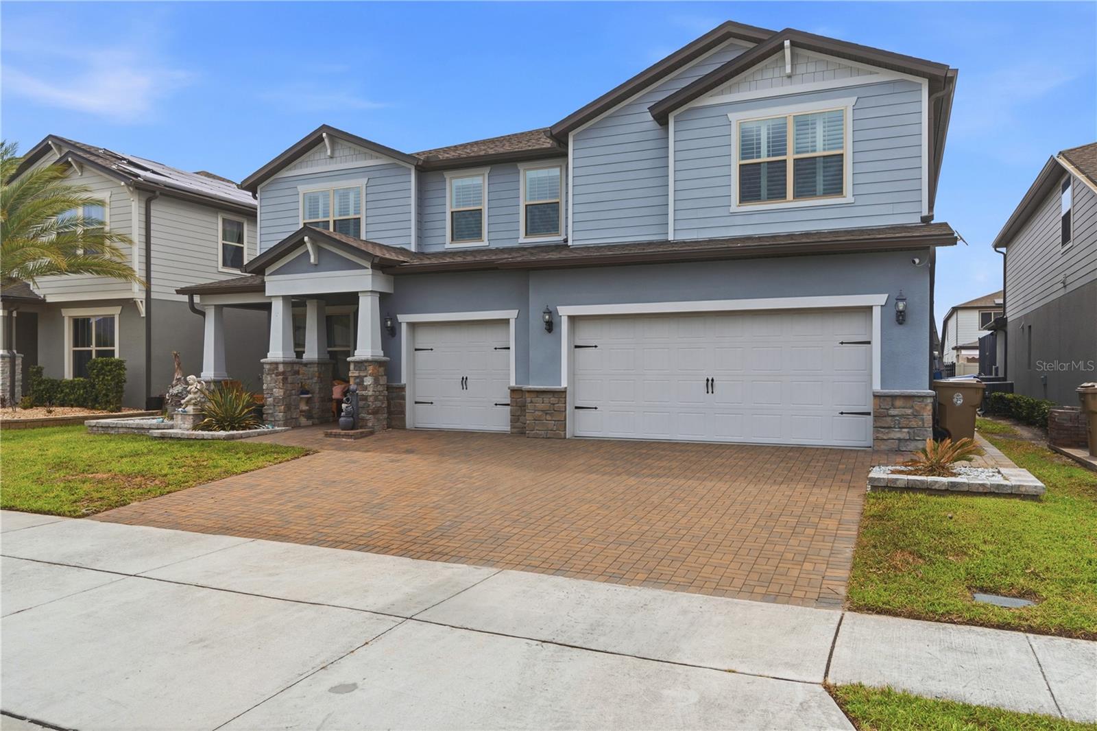 Welcome to an extraordinary residence in the highly desirable Split Oak Estates area of Saint Cloud. Built in 2020, this impressive two-story home offers approximately 5,144 square feet of thoughtfully designed living space, featuring 7 bedrooms, 5 full bathrooms and half bathrooms, and a spacious 3-car garage, making it an ideal choice for large families, multi-generational living, or those who simply desire room to grow.

From the moment you arrive, you'll appreciate the home's commanding curb appeal and modern design. Inside, expansive living areas create the perfect blend of comfort and functionality. The open-concept floor plan is designed for today's lifestyle, featuring oversized gathering spaces, a chef-inspired kitchen with abundant cabinetry and counter space, and multiple flexible living areas that can easily accommodate a home office, media room, fitness space, or playroom.

The luxurious primary suite serves as a private retreat, while the additional bedrooms provide ample space for family members and guests. With five full bathrooms, convenience and privacy are effortlessly achieved throughout the home. The spacious layout offers endless possibilities for entertaining, hosting extended family, or creating dedicated spaces tailored to your lifestyle.

Situated on a professionally maintained homesite within one of Saint Cloud's fastest-growing corridors, residents enjoy convenient access to Lake Nona, Medical City, Orlando International Airport, major highways, shopping, dining, and top employment centers. The location combines suburban tranquility with exceptional connectivity, making it one of Central Florida's most sought-after areas.

This is a rare opportunity to own a grand estate-sized home offering over 5,100 square feet of living space, modern construction, and exceptional versatility. Whether you're seeking a multi-generational residence, space for a growing family, or a home designed for entertaining on a grand scale, 2764 Matera Drive delivers luxury, comfort, and convenience in one remarkable package.