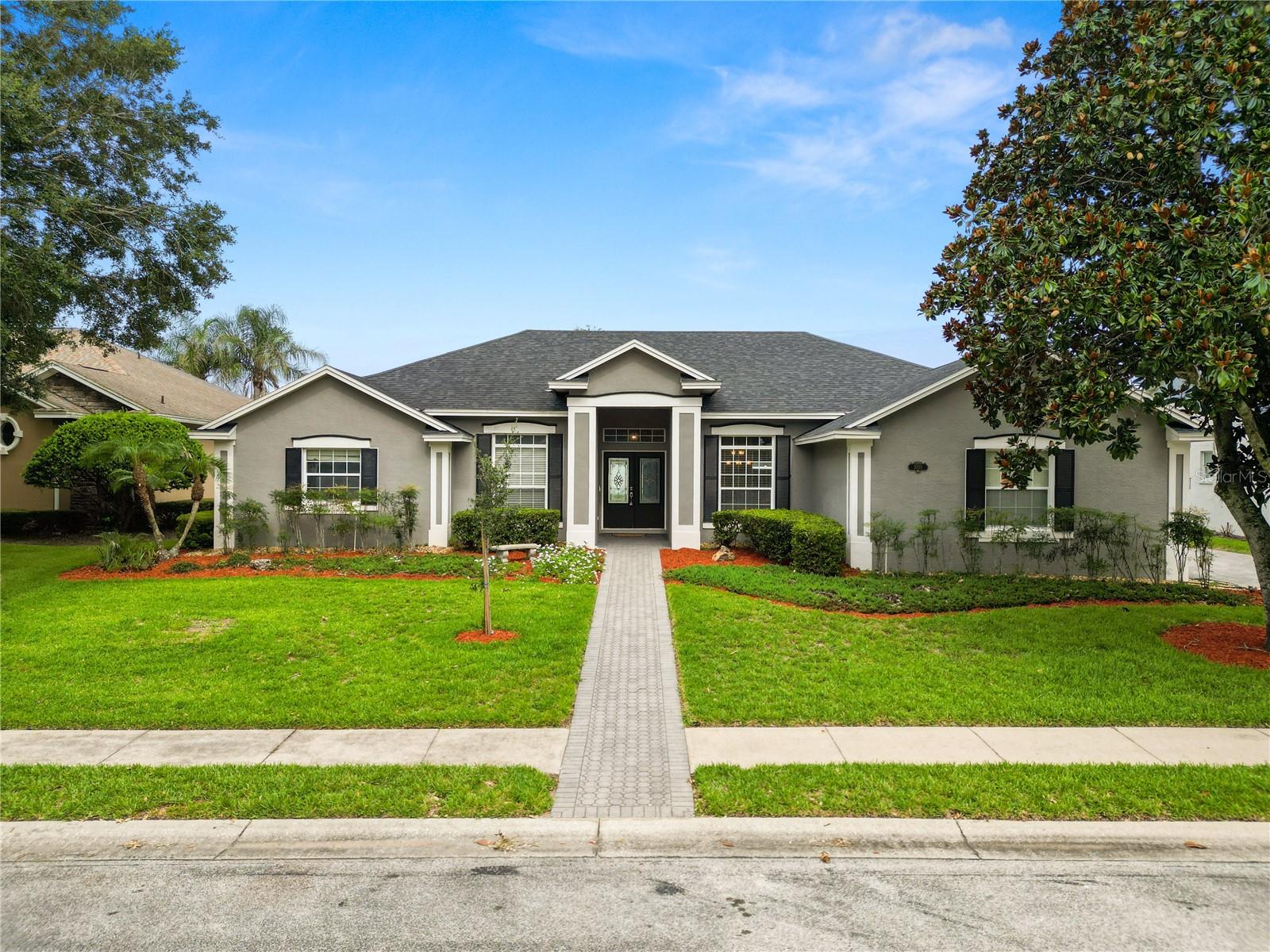 Welcome to 3333 Hawks Ridge Drive, where the Florida pool home lifestyle takes center stage. Located in the established gated community of Hawks Ridge, this spacious 4 bedroom, 2.5 bath home offers the layout, comfort, and outdoor living space buyers are looking for. Inside you're instantly greeted with a view of the pool and backyard, wood and tile floors, plus generous living spaces that work well for both everyday living and entertaining. The kitchen features stainless steel appliances, ample workspace, and a convenient pass-through to the lanai and pool area, making it easy to stay connected while hosting.

The outdoor living space is the true standout. The primary suite, living room, and family room all provide direct access to the screened lanai, creating an easy flow to the 29-foot patio area, outdoor pool shower, and private saltwater pool. The pool is already wired for an electric heater, giving the next owner even more flexibility to enjoy it year-round. A half bath with access to the lanai adds convenience for pool days and guests. The .30 acre lot also offers room to enjoy, including a wooden swing set in the backyard

Additional features include a roof replaced in 2020, two-car side-load garage, surround sound, and a thoughtful floor plan with plenty of room to spread out. Convenient to shopping, dining, and major roadways, this home offers the privacy of a gated community with the everyday comfort and lifestyle that make a house feel like home. Conveniently located to shopping, I-4, the Polk Parkway and more. Call to schedule your Private tour.