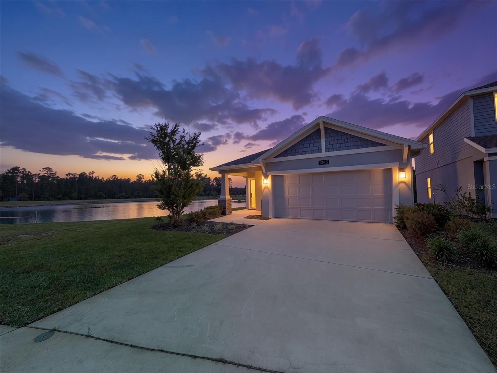 Virtually Staged. Why wait to build when you can own this never-occupied former model home, perfectly situated on an oversized ¼-acre conservation homesite with no rear neighbors, offering exceptional privacy and tranquil natural surroundings.

Designed for both everyday comfort and effortless entertaining, this beautifully appointed single-story residence features a bright, open-concept floor plan where the gourmet kitchen, dining area, and spacious family room flow seamlessly together. Large windows fill the home with natural light while showcasing peaceful conservation and water views.

Privately positioned at the rear of the home, the owner's suite provides a relaxing retreat complete with a generous walk-in closet and a well-appointed en-suite bathroom. Two additional bedrooms offer flexibility for family, guests, or a home office to suit your lifestyle.

Located in the highly desirable city of Daytona Beach, residents enjoy an exceptional Florida lifestyle surrounded by scenic nature preserves, highly rated schools, world-famous beaches, and an abundance of shopping, dining, and entertainment. Popular attractions including the Daytona International Speedway and the Daytona Beach Boardwalk are just minutes away.

With convenient access to Interstate 95, Interstate 4, and US Highway 1, commuting to Orlando, Jacksonville, and Florida's beautiful east coast destinations is effortless.

Whether you're searching for a primary residence, vacation retreat, or investment property, this exceptional former model offers the rare opportunity to own a like-new home on a premium oversized homesite in one of Daytona Beach's most desirable locations.