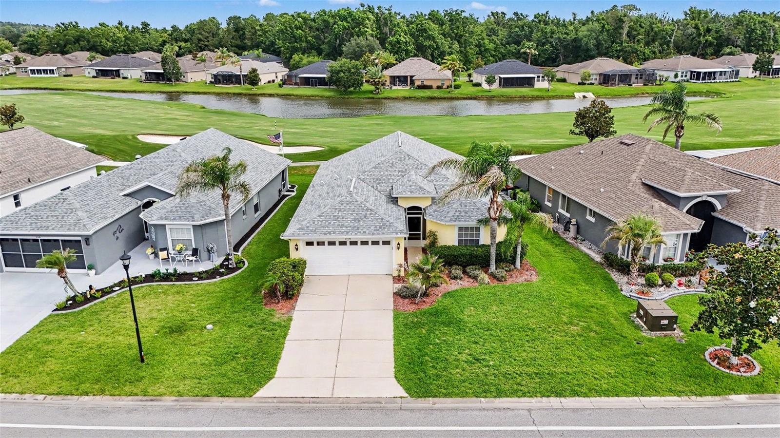 Enjoy beautiful golf course and water views from this home in the sought-after Tampa Bay Golf & Country Club, a gated 55+ community. Ideally situated along the 11th fairway, this 2-bedroom, 2-bath home with a dedicated den/office offers a comfortable layout designed for everyday living and entertaining. The open kitchen overlooks the main living area, creating an inviting space. Tile flooring extends throughout the home, providing a clean, cohesive look and easy upkeep. The extended screened lanai is the perfect place to relax and take in the scenic golf course and water views, whether enjoying your morning coffee or unwinding at the end of the day. The roof was replaced in 2022. The HOA includes lawn care, cable, internet, and access to an impressive selection of community amenities. Residents enjoy swimming pools, tennis and pickleball courts, a fitness center, clubhouse activities, and a vibrant social calendar. Golf enthusiasts will appreciate the community's 18-hole championship course and 9-hole executive course, while the on-site restaurant and pub provide convenient dining and gathering spots. Discover the active Florida lifestyle that makes Tampa Bay Golf & Country Club such a popular place to call home.