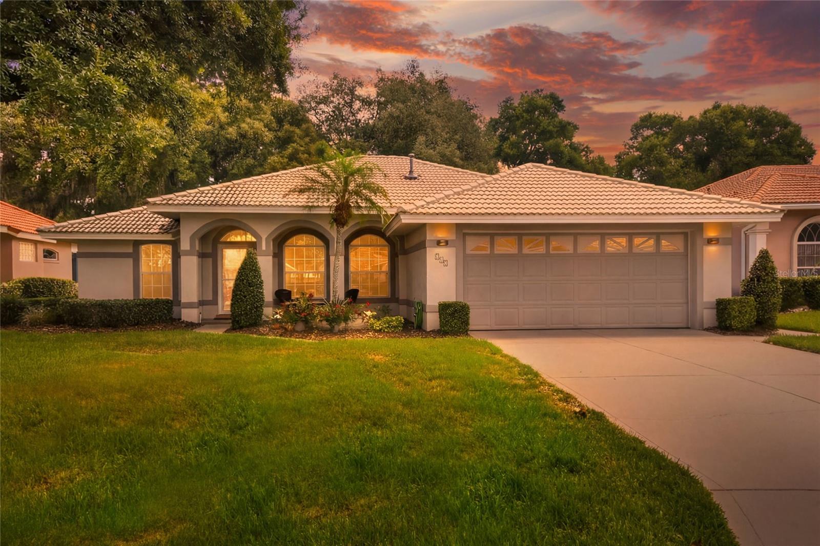 WELCOME HOME to effortless Florida living with a view you'll never tire of! From the moment you step through the front door, your eyes are immediately drawn to the breathtaking, million-dollar view overlooking the well maintained fairways of the private golf course. Combined with mature tropical landscaping, exceptional curb appeal, and a charming covered front porch that's perfect for enjoying your morning coffee, this home offers an unforgettable first impression.

Nestled within the gated community of Lake Bess Country Club, this beautifully maintained 3-bedroom, 2-bath residence offers the perfect blend of elegance, comfort, and carefree living. Soaring ceilings and abundant natural light create a warm, inviting atmosphere, while the expansive Florida Room seamlessly extends the living space, making it ideal for entertaining or relaxing year-round. During the cooler fall and spring months, the wall of windows opens completely, welcoming refreshing cross breezes creating the perfect indoor-outdoor Florida lifestyle.

The spacious primary suite is a true private retreat, entered through elegant double doors and thoughtfully appointed with plantation shutters, two walk-in closets, a dedicated linen closet, dual vanities, and a beautifully tiled walk-in shower, offering both comfort and functionality.

The eat-in kitchen provides generous cabinet space, all appliances, and a functional layout that keeps you connected to the main living areas. Off the kitchen is a spacious laundry room with full sink and cabinetry.

Additional features include a NEW A/C system, durable tile roof, whole house generator that comes on the second power goes out, private irrigation well, and a screened lanai where you can unwind while taking in peaceful golf course views and Florida's beautiful weather.

Life at Lake Bess Country Club is about more than just owning a home—it's embracing a lifestyle. Enjoy unlimited access to the immaculately maintained executive golf course, relax by the heated community pool, gather with neighbors at the clubhouse, or simply enjoy the gentle breeze while watching golfers pass by from the comfort of your own backyard.

The monthly HOA fee of $500 includes lawn care, shrub maintenance, the heated community pool, and clubhouse access, as well as, unlimited golf on the beautifully maintained executive course—an outstanding value for those who love the game.

Being offered fully furnished, this exceptional golf course home is truly move-in ready. If you've been searching for spectacular views, a peaceful setting, and maintenance-free Florida living in a secure gated community, this is the one. Schedule your private showing today!