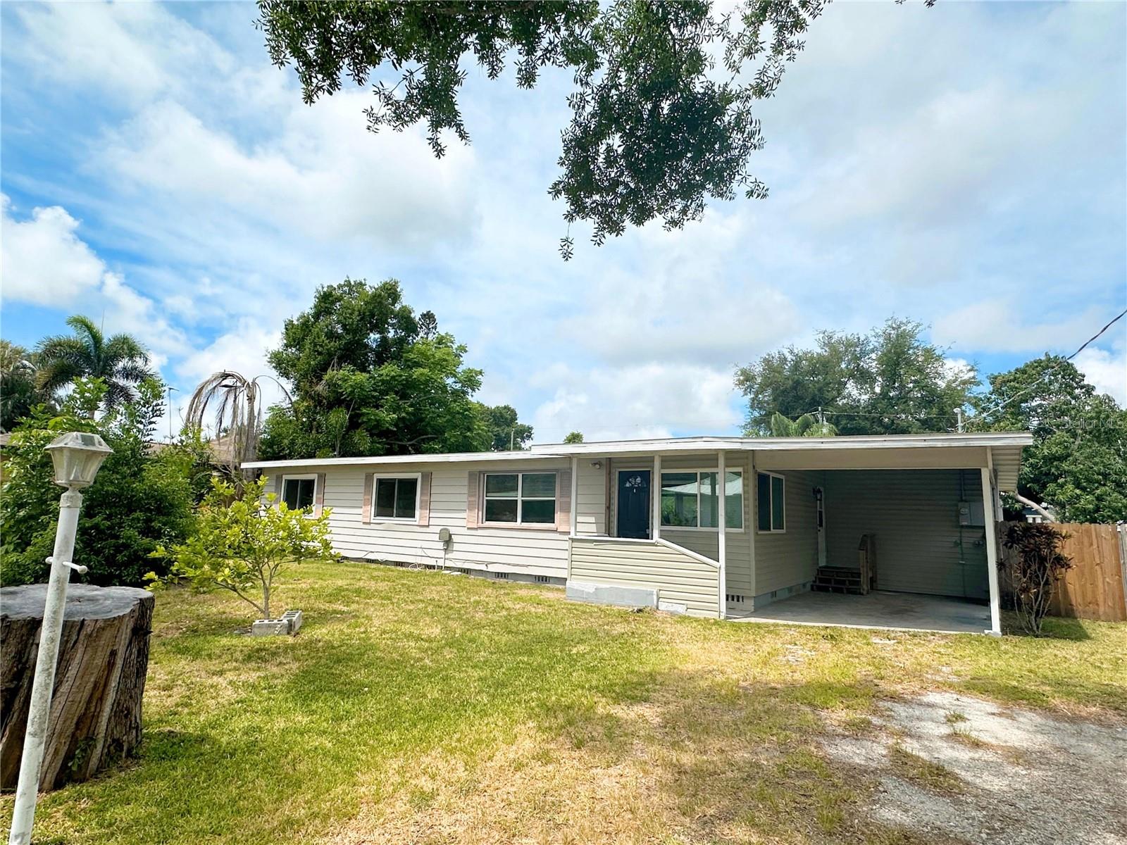 Don’t miss this opportunity to own a vintage piece of Sarasota. Perfectly located within one of Sarasota’s highly sought-after A-rated school districts, this property offers exceptional value with no HOA and no CDD fees—ideal for homeowners, investors, or anyone seeking a move-in-ready home close to everything. This charming 3-bedroom, 1.5-bath residence sits on a double lot surrounded by mature fruit trees including mango, banana, lemon, and guava. Inside, you’ll find beautiful wood tongue-and-groove ceilings and an inviting open floor plan anchored by an oversized kitchen island with abundant counter space—perfect for entertaining and everyday living. Major upgrades provide peace of mind, including a new roof (2025), new HVAC system (2025) with a 12-year transferable warranty, new water filtration system (2025), upgraded electrical panel (2025), new insulation (2025), and new flooring throughout the living room and bedrooms (2025). Additional updates include a new water heater (2024), upgraded bathroom (2025), and new kitchen appliances including dryer, range, and refrigerator (2024). Step outside to a 12x12 Trex deck, a fully fenced yard, and a charming chicken coop, creating a unique homestead-style setting. A standout feature is the property’s direct adjacency to the Legacy Trail bike path, offering unmatched access to outdoor recreation.
The location is exceptional—just minutes from shopping, dining, parks, and I-75. Zoned for Ashton Elementary, Sarasota Middle, and Riverview High, some of the highest-rated schools in the county. You’re only 6 miles from world-famous Siesta Key Beach and a 30-minute drive to Warm Mineral Springs Park, Florida’s only natural warm mineral spring (85°F year-round). With no deed restrictions, this property offers flexibility, lifestyle, and long-term value in one of Sarasota’s most desirable areas.
