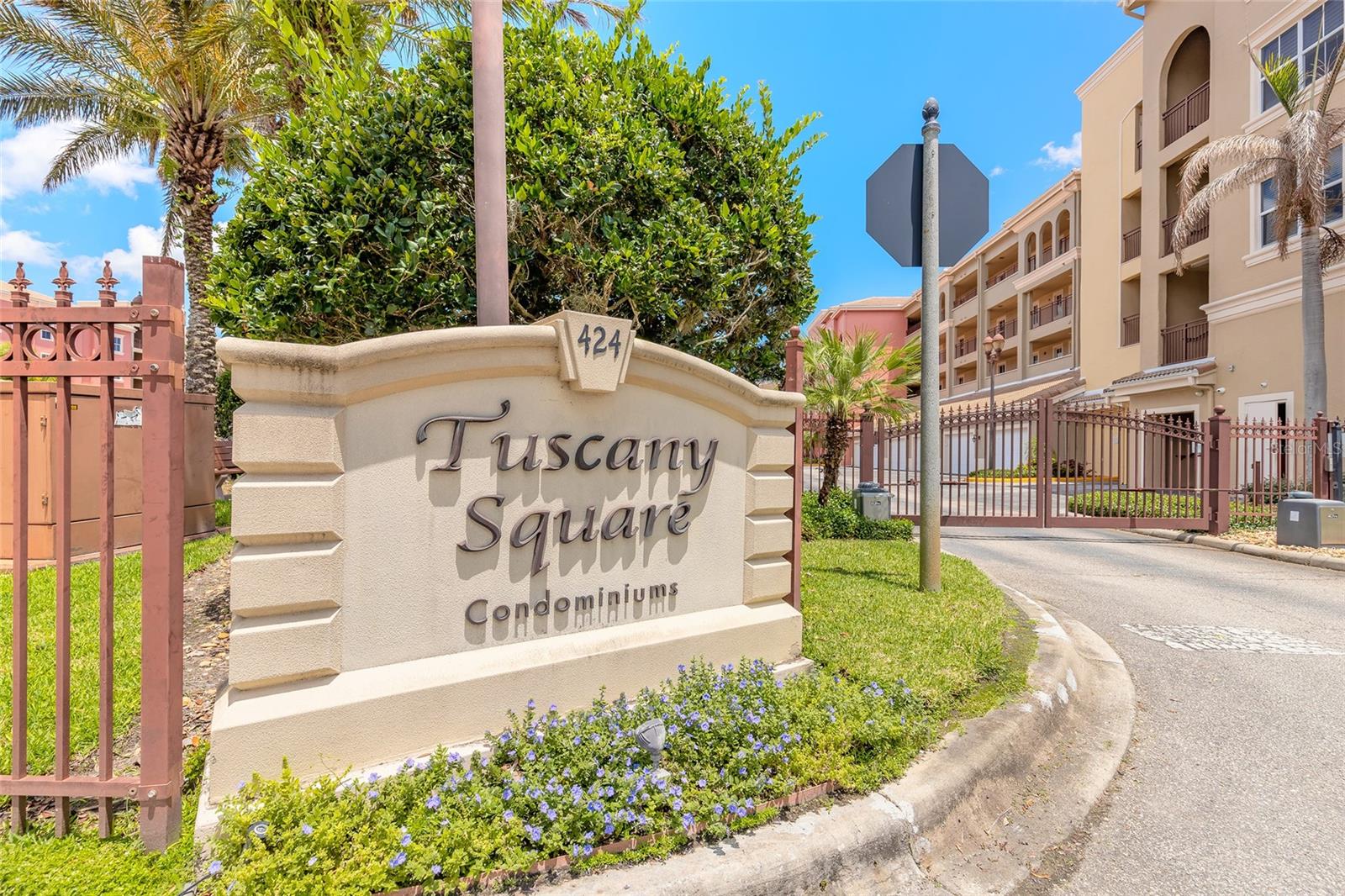 Welcome to your top-floor Waterfront retreat at 424 Luna Bella Ln Unit 415 in beautiful Tuscany Square at Venetian Bay. This elegant 2-bedroom, 2-bath condominium offers 1,478 square feet of thoughtfully designed living space with stunning lakefront views and an inviting open-concept layout perfect for everyday living and entertaining. Step inside to find a spacious living area highlighted by tray ceilings, abundant natural light, and a built-in wet bar that adds both style and functionality. The kitchen is beautifully appointed with two-tone shaker-style cabinetry, stone-look countertops, stainless steel appliances, and a peninsula with seating that seamlessly connects to the main living space. Enjoy peaceful mornings and relaxing evenings from the covered balcony overlooking the water, complete with decorative metal railing and an outdoor ceiling fan for added comfort. The spacious primary suite features a spa-inspired bath with a walk-in shower and dual vanity with light cabinetry, creating a bright and relaxing atmosphere. Light carpet flooring throughout enhances the warm and comfortable feel of the home.  The one car garage is also accompanied by an apron parking spot, so 2 vehicles can be parked within a gated community. Tuscany Square condo is surrounded by lush tropical landscaping, this penthouse offers the perfect balance of privacy, comfort, and convenience. As part of Venetian Bay, you'll enjoy access to pickleball and tennis courts, basketball court, miles of trails.  The vibrant town center has a convenience market, restaurants, spa, coffee shop, fitness center, a tiki bar and resort style pool. Golf enthusiasts will love the 18-hole championship golf course and clubhouse. Minutes from Canal Street Historic District, Flagler Avenue, and the beautiful beaches of New Smyrna Beach. All information is intended to be accurate, however not guaranteed.