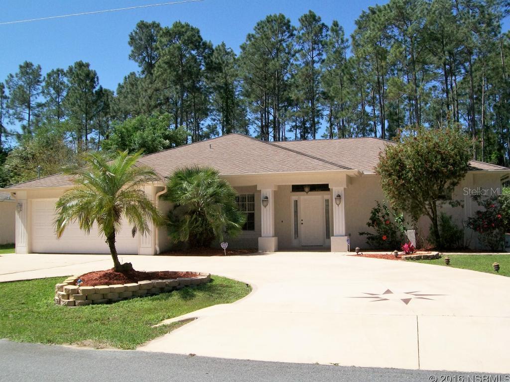 STOP LOOKING! Deal of the century... better than NEW with many upgrades. Beautiful 3 bedroom 2 bath home features California Closets in the master bedroom and also in the kitchen pantry. Large open kitchen that overlooks the den w/fireplace and eat-in-kitchen. Formal living room and dining room. Large front entry lanai, backyard screened in lanai and a large open patio great for grilling. This home comes with a generator for power backup, hurricane shutters for all doors and windows. Whole home water softener and an extra bonus kitchen faucet water purification system. Recessed lights in the master bedroom and also in the kitchen for an added bonus. This home is immaculate inside and out and detailed service records for the A/C, water heater,water softener, irrigation system, appliances, duct cleaning, termite bonded and more. Enjoy your over sized two car garage with storage cabinets and flooring for over the garage attic for extra storage. Home comes with gutters with french drains, over twenty thousand dollars in killer landscaping. Six zoned irrigation sprinkler system with private well. Circular drive with 4-foot sidewalks all around the perimeter of the home. 8 x10 Shed with electric. Home comes cable ready, and a whole home security system. Only two minutes away from Town Center and ten minutes from Flagler Beach. Price right and won't last long. All information is intended to be accurate but not guaranteed. ;Water: City