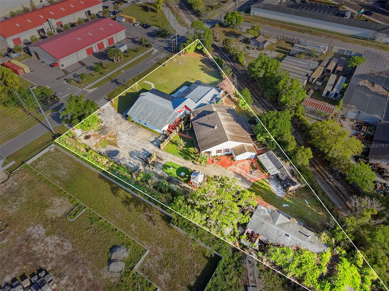 Positioned in the heart of Apopka’s evolving downtown corridor, 227 S Hawthorne Ave offers a rare opportunity to acquire a 1.38± acre multi-building commercial property within the City’s MU-D (Mixed Use Downtown) zoning district, allowing for a variety of potential uses including office, institutional, redevelopment, or mixed-use concepts.

The property features approximately 14,095 SF across multiple structures, including a primary assembly building, additional recreational/flex space, and a residential unit, providing flexibility for owner-users, investors, or organizations seeking a central location with expansion potential.

Strategically located within the Apopka Community Redevelopment Area (CRA), the site benefits from ongoing public and private investment focused on revitalization, infrastructure enhancements, and economic development initiatives designed to support business growth and property value appreciation. Its proximity to downtown Apopka places the property near municipal services, retail amenities, dining, and major transportation corridors providing convenient connectivity to SR-441, SR-436, and the greater Orlando metro area.

Situated on over 60,000 SF of land, the site offers ample parking potential, redevelopment flexibility, and visibility within an established commercial and civic district.  Call today for your private showing.