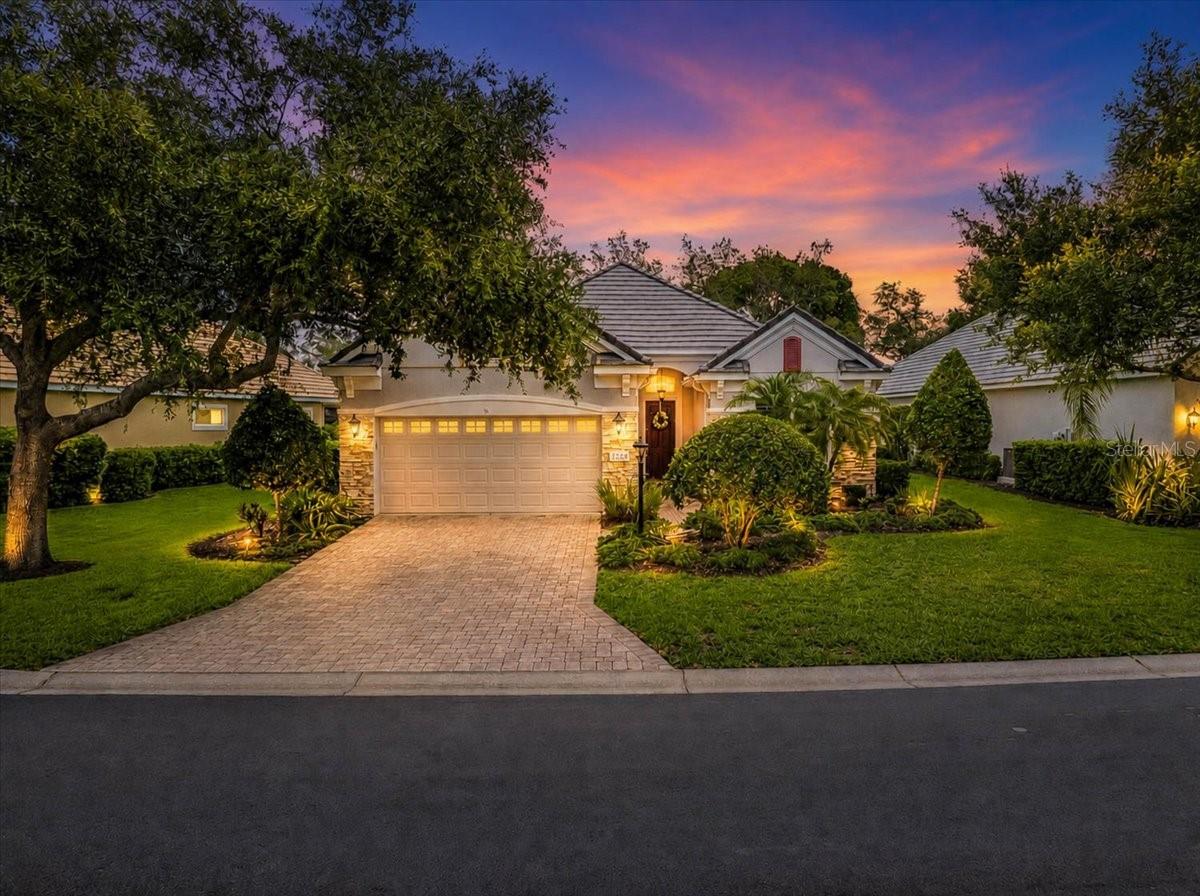 Experience the best of Florida living in this beautifully maintained maintenance-free home, perfectly positioned on the 4th hole of the King Dunes golf course with breathtaking lake and fairway views. Enjoy spectacular southwest exposure, creating a bright and inviting atmosphere throughout this exceptional residence.
Designed for both comfortable everyday living and effortless entertaining, the spacious open floor plan features soaring ceilings, crown molding, abundant natural light, and a cozy electric fireplace that serves as the focal point of the great room. The beautifully updated kitchen offers quartz countertops, a neutral tile backsplash, stainless steel appliances, a gas range, and a charming breakfast area overlooking the picturesque views beyond.
The owner's retreat is a peaceful sanctuary dual closets, dual vanities, and a spacious updated walk-in shower. Guests will appreciate the thoughtfully designed split-bedroom layout and brand-new carpeting in both guest bedrooms. The bright den just off the living area makes a great overflow space or office. Additional updates include, newer LED recessed lighting, HVAC system (2022), updated bathroom tilework, plantation shutters throughout, and metal hurricane shutters for added peace of mind. Move-in ready and meticulously cared for with new luxury vinyl throughout, this home truly shows like a model.
Located within the prestigious Lakewood Ranch Golf & Country Club, residents enjoy access to world-class amenities including championship golf, tennis, 20 pickleball courts, paddle courts, fitness facilities, dining, social events, bocce, croquet. Conveniently located near Main Street at Lakewood Ranch, Waterside Place, The Mall at University Town Center. Downtown Sarasota and renowned Siesta Key Beach is just a short drive away. This exceptional property offers the perfect combination of luxury, convenience, and the coveted Florida lifestyle.