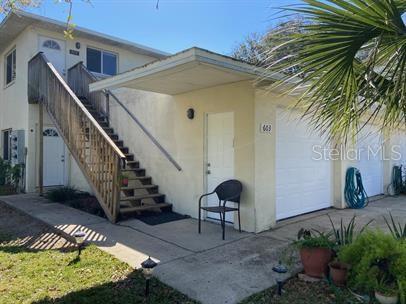 Great 2 bedroom 2 bath 1 car garage unit with in a triplex! Perfect Central Location on Beachside in New Smyrna Beach! Walk to The Garlic, Norwood's, the framer's market, the beach, few blocks from Flagler Ave and super close to Publix. Open floor plan, Tile floors throughout, huge master bedroom walk-in closet, and balcony. Make this place a home! Come live the NSB Lifestyle!