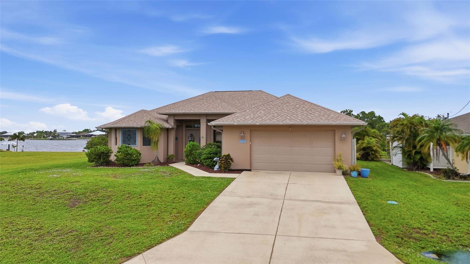 Experience exceptional waterfront living in this beautifully updated 3-bedroom, 3-bathroom, 2-car garage pool home offering 80 feet of canal frontage, a private dock with covered boat lift, and quick boating access. Complete with a den, family room, heated saltwater pool and spa, and countless upgrades throughout, this home is designed for those who appreciate luxury, comfort, and the Southwest Florida boating lifestyle.

INTERIOR FEATURES

• 3 bedrooms, 3 bathrooms
• 2-car attached garage
• Den/flex room
• Separate family room
• French door entry
• High vaulted ceilings
• Tile flooring throughout
• Bright, open floor plan
• Spacious living room with French doors to the lanai
• Formal dining room
• Family room with built-in shelving
• Non-vented propane fireplace
• French doors from family room to lanai
• Hurricane protection

KITCHEN FEATURES

• Eat-in kitchen with water views
• Whirlpool reverse osmosis system (2024)
• Stainless steel appliances
• Built-in oven and microwave
• Gas cooktop (2025)
• Stone countertops (2025)
• Updated sink, faucet & disposal (2025)
• Breakfast bar
• Dinette overlooking the canal
• Closet pantry
• Abundant cabinet storage

PRIMARY SUITE

• Spacious primary bedroom
• Private lanai access
• Dual walk-in closets
• En-suite bathroom
• Dual sink vanity
• Soaking tub
• Walk-through Roman shower
• Private water closet

GUEST BEDROOMS & BATHS

• Split-bedroom floor plan for added privacy
• Built-in closets in both guest bedrooms
• Full guest bathroom nearby
• Versatile den ideal for a home office, media room, or additional guest space
• Third full bathroom with convenient lanai/pool access

OUTDOOR FEATURES

• 80 feet of waterfront
• Screened lanai
• Outdoor kitchen with bar seating
• Heated saltwater pool & spa
• Canal views
• Waterfront seating area
• 30' x 26' private dock
• Covered 10,000-lb boat lift with canopy (2022)
• GEM remote-control boat lift system (2022)

RECENT UPDATES

• 2023 Roof
• 2023 Panoramic pool cage
• 2022 Solar panels for pool heating
• 2022 2-ton & 4-ton HVAC systems with heat pumps
• 2024 Cool deck coating on lanai
• 2024 Saltwater pool conversion
• 2024 Whirlpool reverse osmosis system
• 2025 Kitchen updates including stone countertops, gas cooktop, sink, faucet & disposal
• 2025 Hot water heater
• 2026 New boat lift motor and outside piling wiring

LOCATION HIGHLIGHTS

• Prime boating location with quick access to Charlotte Harbor
• Minutes to world-class fishing and Gulf waters
• Close to shopping, dining, and medical facilities
• Easy access to US-41 and I-75
• Convenient to Downtown Punta Gorda and Port Charlotte amenities

Whether you're looking for the perfect waterfront retreat or a home built for entertaining, this exceptional property delivers the best of Florida living with premium boating amenities, luxurious updates, and breathtaking canal views right from your backyard. Schedule your private showing today!