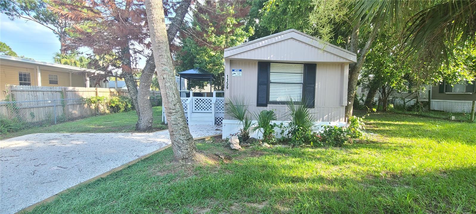 **OWN YOUR OWN  LOT with NO LOT RENT **REMODELED**2 Beds X 2 Full Baths + (1) Storage SHED** BUILT in 1984**PARTIALLY FENCED BACKYARD with METAL GAZEBO on a Large Deck**NEW KITCHEN CABINETS with Stainless Steel Appliances**NEW VINYL FLOORING with 5 ½ inch baseboards throughout**NEW CENTRAL AC unit**NEW LIGHT FIXTURES and CEILING FANS with Remote Control**METAL ROOF has been SEALED with 2 coats of Modified Acrylic Sealant **FRESHLY PAINTED INSIDE/OUT** DECORATED CATHERDRAL CEILING** In the heart of Port Orange, close to shopping centers, medical offices, Hospitals and 10 min to the beach. This lot is high and dry with plenty of parking, and lots of landscaping front and back. All measurements are approximate but not guaranteed. HURRY UP...........Will Not Last Long.