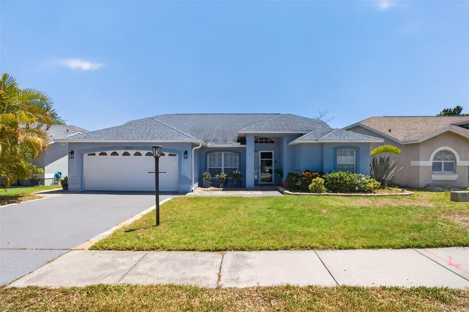 Welcome to 12611 Pineforest Way E in Largo, Florida — a beautifully updated 3-bedroom, 2-bath pool home with a 2-car garage designed for comfort, style, and easy Florida living.

Step inside to soaring ceilings, warm wood-look flooring, and an inviting open layout featuring a stunning modern fireplace accent wall that creates the perfect focal point for the living space. The fully updated kitchen showcases sleek navy cabinetry, stainless steel appliances, quartz countertops, designer lighting, and a spacious breakfast bar overlooking the main living area — ideal for entertaining family and friends.

Enjoy indoor-outdoor living with an enclosed pool area perfect for relaxing year-round, hosting gatherings, or enjoying your own private backyard retreat.

Major updates provide peace of mind, including:
-Roof replaced in 2017
-HVAC only 3 years old
-Hot water heater 4 years old
-Plumbing updated in 2024

Conveniently located near beaches, shopping, dining, parks, and major roadways, this move-in-ready home combines modern upgrades with everyday functionality in one of Largo’s desirable neighborhoods.

Don’t miss your opportunity to own this beautifully maintained pool home in the heart of Pinellas County!