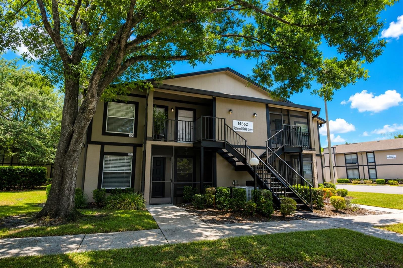 Virtually Staged. Welcome to easy Florida living in the sought-after North Oaks community! This MOVE-IN READY, beautifully updated FIRST-FLOOR condominium offers 2 spacious bedrooms, 2 full bathrooms, and the convenience of single-level living with no stairs to navigate and just steps away from the community pool and amenities!

Step inside to discover a freshly painted interior in Sherwin-Williams' popular "Agreeable Gray," creating a bright, modern, and move-in-ready feel throughout. The thoughtfully designed split-bedroom floor plan offers privacy for both owners and guests, while the open living and dining areas provide a comfortable space for everyday living and entertaining.

The kitchen and both bathrooms have been enhanced with elegant granite countertops, adding timeless style and durability. BRAND NEW LUXURY VINYL FLOORING in both bedrooms gives the home a fresh, updated look, while the primary suite features a generous walk-in closet complete with custom organizers to maximize storage. The en-suite bathroom is also equipped with grab bars for added accessibility and peace of mind.

Enjoy the convenience of window treatments already in place, including blinds and plantation shutters throughout the home. Just steps from the community pool, this prime location allows you to enjoy resort-style amenities with ease.

North Oaks residents enjoy beautifully maintained grounds, a sparkling community pool, tennis, pickleball, racquetball courts, and ample parking. The monthly HOA fee includes water, sewer, trash, exterior maintenance, and access to community amenities (buyer to verify).

Ideally located near USF, Moffitt Cancer Center, AdventHealth, the VA Hospital, Busch Gardens, I-75, shopping, dining and Tampa International Airport, this home offers exceptional convenience for Homeowners, Medical Professionals, anyone needing to be near the USF Tampa Campus, Moffitt, Investors, or anyone seeking a LOW MAINTENENANCE LIFESTYLE in the heart of North Tampa. Don't miss your opportunity to own this move-in-ready gem in one of the area's most convenient locations!