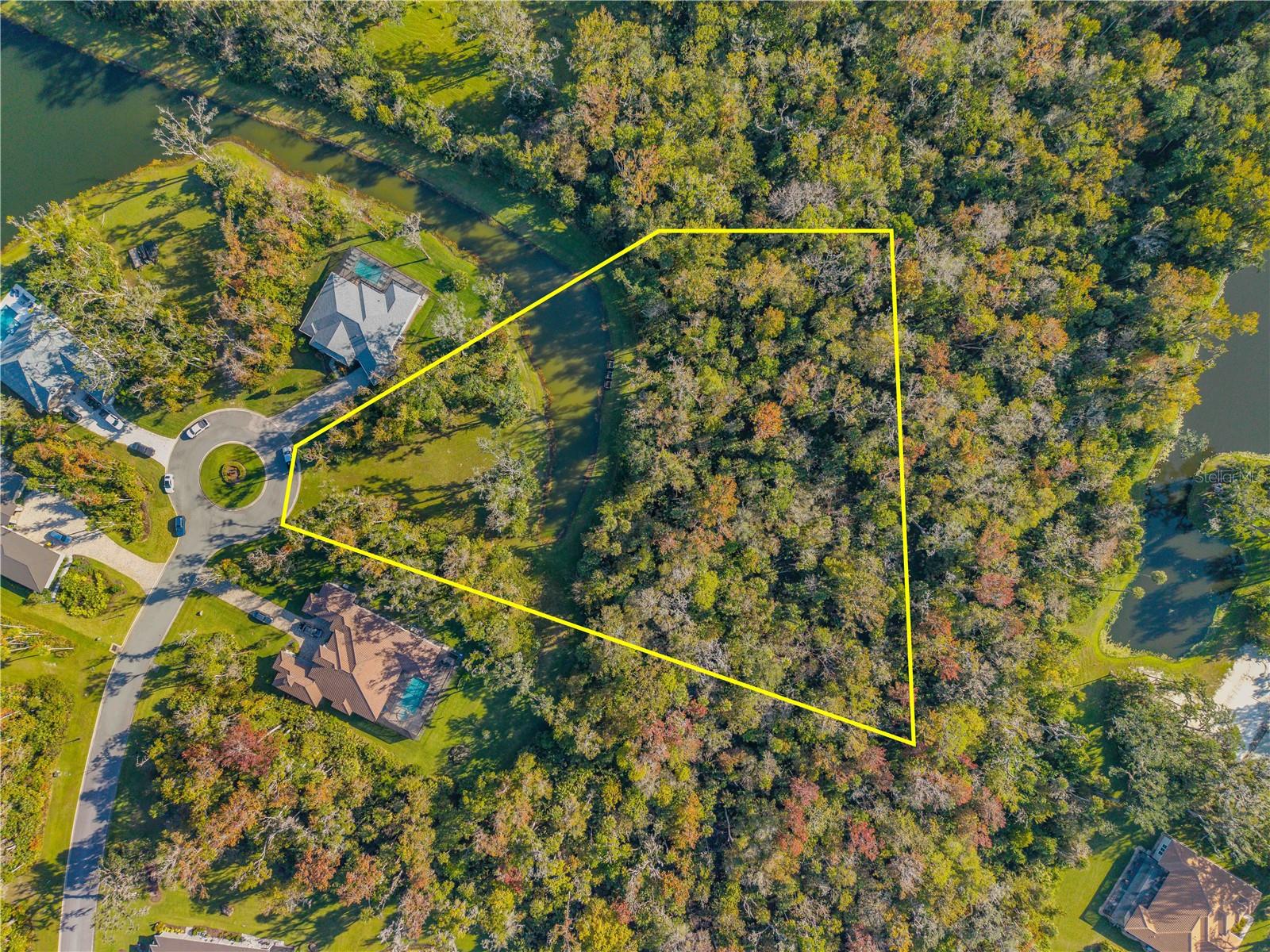 Discover one of the largest and most desirable parcels in the exclusive gated community of Liberty Village. This impressive 2.66-acre home site is perfectly positioned at the end of a quiet cul-de-sac, offering unmatched privacy and a premier setting surrounded by natural beauty. With city water and sewer already available, this lot provides the ideal canvas to design and build your custom estate home with the builder of your choice. Liberty Village is a private, gated enclave featuring five serene lakes, majestic oak trees, and a beautifully landscaped entrance complete with its signature Liberty Bell tower. Residents enjoy a peaceful, country-like setting just minutes from New Smyrna Beach’s best dining, shopping, golf courses, and the Atlantic coastline. Conveniently located near I-95, US-1, and local marinas, this community is perfect for those who desire both tranquility and accessibility. Large parcels like this are a rare find—don’t miss the opportunity to secure one of the final oversized estate lots in New Smyrna Beach’s best-kept secret: Liberty Village.