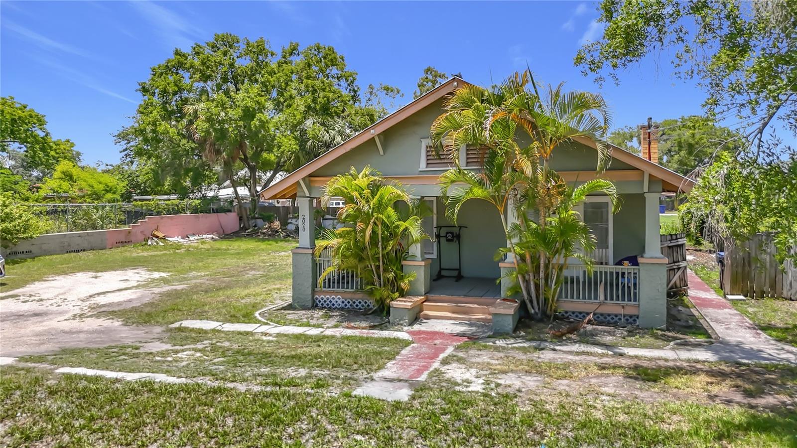 Income-producing duplex with exceptional investment potential! The layout is ideal for individual room rentals, maximizing income! This single-building property features two units AND a vacant lot: a 4-bedroom unit currently leased through August 2026, and a 1-bedroom, 1-bath unit offering a full kitchen and living area. The sale also includes the adjacent vacant lot, providing additional value and future potential for expansion, extra parking, outdoor space, or other possibilities (buyer to verify permitted uses). HVAC was updated in 2016. Ideally located just minutes from Downtown Tampa, Ybor City, local parks, shopping, dining, and major highways. A fantastic opportunity for investors seeking strong rental potential or owner-occupants looking to live in one unit while generating income from the other. Schedule your private showing today!
