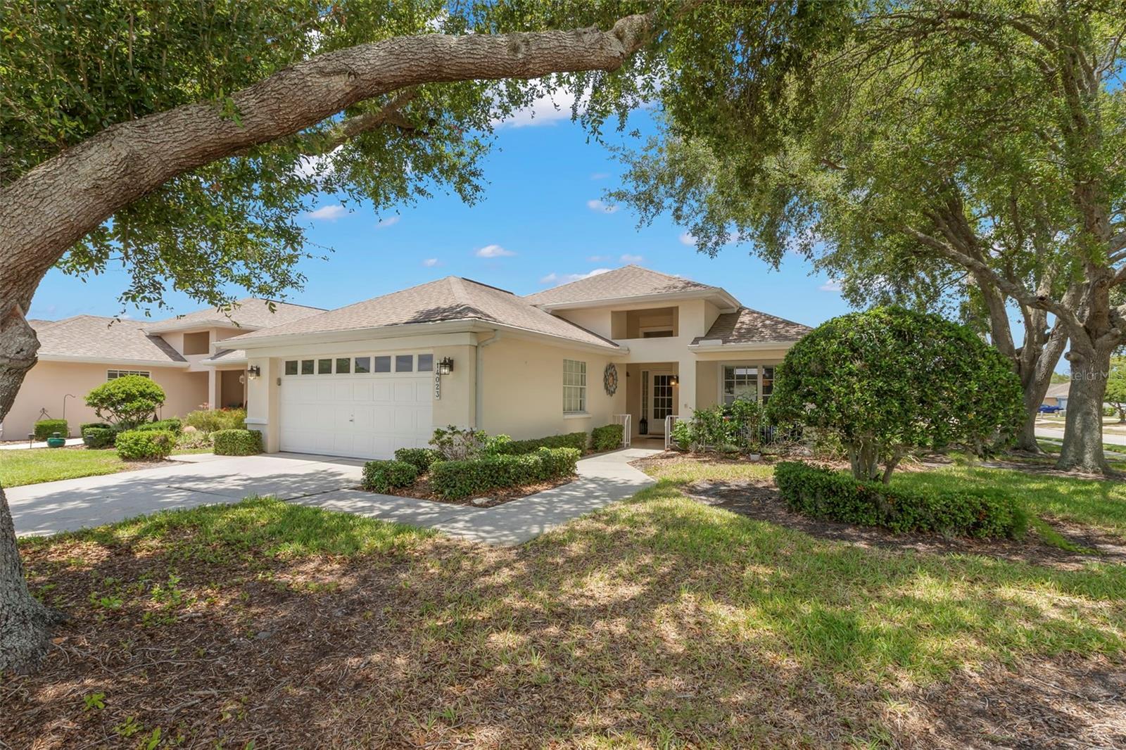 Welcome home to this beautifully maintained and thoughtfully designed residence, where comfort, convenience, and the Florida lifestyle come together seamlessly. Nestled within the desirable Beacon Point community, this spacious home offers an inviting open-concept floor plan ideal for both everyday living and effortless entertaining. Even better, the HOA fee includes cable, internet, trash service, lawn maintenance, and access to the community pool, allowing you to enjoy a truly low-maintenance lifestyle. As you arrive, you'll immediately appreciate the charming front porch—an ideal spot to sip your morning coffee, unwind with a good book, or simply take in the peaceful surroundings. Step through the front door and discover a light-filled interior with soaring openness and an airy ambiance that instantly feels like home. Privately positioned at the rear of the residence, the generous primary suite serves as a relaxing retreat, featuring beautiful windows overlooking the backyard, two spacious walk-in closets, and an en suite bath complete with a tub/shower combination. At the heart of the home, the bright and cheerful kitchen offers everything you need, including a breakfast bar, cozy breakfast nook, and pantry closet with built-in shelving. The kitchen flows effortlessly into the dining and living areas, creating the perfect setting for gathering with family and friends. Just off the kitchen and dining space, you'll find a versatile bonus room surrounded by windows that bathe the space in natural light. Whether you envision a sunroom, home office, hobby room, reading retreat, or additional living area, this flexible space can easily adapt to your needs and even provides convenient exterior access. Step outside to your expansive screened lanai, a true extension of the home's living space. Perfect for outdoor dining, entertaining, or simply relaxing while enjoying Florida's beautiful weather, this inviting retreat offers endless opportunities to embrace indoor-outdoor living. Back inside, an additional bonus room located off the great room offers even more flexibility. Complete with a large wall closet, this space could serve as a third bedroom, private office, fitness room, or den. The secondary bedroom is thoughtfully situated toward the front of the home, adjacent to a full guest bath featuring a convenient step-in shower. Additional highlights include a spacious laundry room with extra overhead cabinetry and a utility sink, access to the two-car garage, a hallway linen closet, and an additional storage closet to keep everything organized. Residents of Beacon Point enjoy access to a sparkling community pool and a prime location with easy access to US Highway 19, making commuting simple and convenient. Shopping, dining, medical facilities, and everyday essentials are just minutes away, providing the perfect balance of tranquility, accessibility, and carefree Florida living. This is more than just a home—it's a lifestyle you'll love coming home to every day.