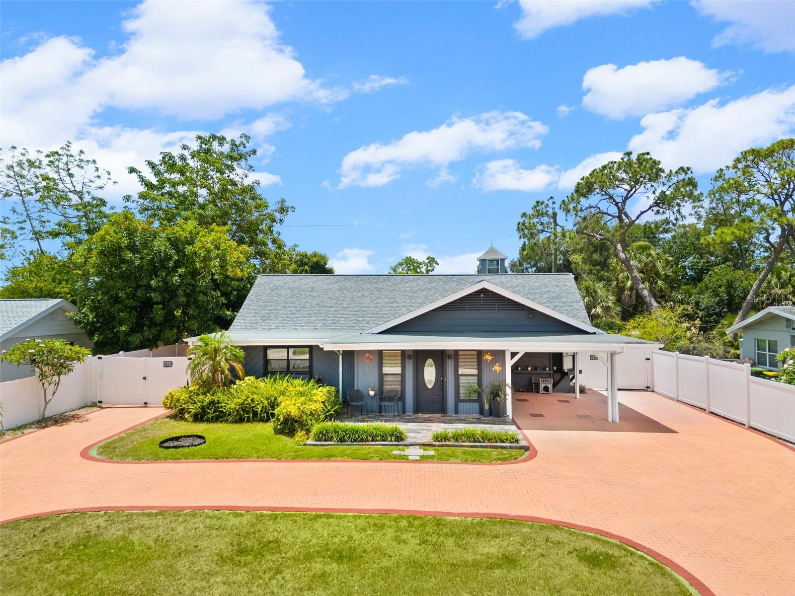 Incredible Sarasota Property Featuring Two Homes near Downtown. Rare Sarasota opportunity with private guest quarters and direct access to the Legacy Trail! Welcome to 2712 Nancy Street, a unique and versatile property offering a spacious 3-bedroom, 2-bath main, 1-Carport residence plus separate guest quarters complete with an additional 4th bedroom, 1.5 baths, kitchen, and custom built-ins — ideal for multigenerational living, extended family, guests, rental income, or a private home office setup.

Blending timeless 1950s charm with thoughtful updates, New A/C 2026, the home showcases beautiful Amish craftsmanship throughout, including custom built-ins, detailed carpentry, arched doorways, and classic barrel ceilings. Recent updates include a newer roof (3 years old), luxury vinyl flooring, granite kitchen countertops, and stainless steel appliances that are approximately 3 years old. The spacious Primary Suite offers exceptional flexibility with a walk-in closet, private bath, hobby room, and sitting room that can easily adapt to a variety of lifestyle needs.

Outside, the property is designed for convenience and entertaining. A U-shaped driveway with pavers in both the front and backyard provides excellent and secure parking for a golf cart, boat, RV, or multiple vehicles. The fully fenced backyard features a storage shed and an entertainer’s dream setup complete with a covered patio/bar area and hot tub. With minimal grass cutting required and irrigation in the front yard, the outdoor spaces are both functional and low maintenance.

Perfectly positioned in the heart of Sarasota, this home offers an unbeatable lifestyle with the Legacy Trail directly behind the property. Hop on your bike from the backyard and reach Payne Park, Publix, Alta Vista Elementary, Sarasota High School, Arlington Park, and Pinecraft in 15 minutes or less. Downtown Sarasota is just 2 miles away, while Lido Beach and Sarasota’s world-famous beaches are only a short drive away.

This location combines convenience and recreation like few others. Walk to events at the Sarasota Fairgrounds without the hassle of parking, enjoy fireworks views from Bayfront Park, or take a quick bike ride for pizza or ice cream in nearby Pinecraft. Sarasota Memorial Hospital is less than 2 miles away, making everyday living exceptionally convenient.

Situated on a quiet street where many neighbors have lived there for over 40 years, the neighborhood offers a welcoming atmosphere and a rich blend of cultures and backgrounds that truly make this area special. Whether you are searching for a primary residence, investment opportunity, or flexible multigenerational property, this home delivers location, lifestyle, character, and versatility all in one exceptional Sarasota address.